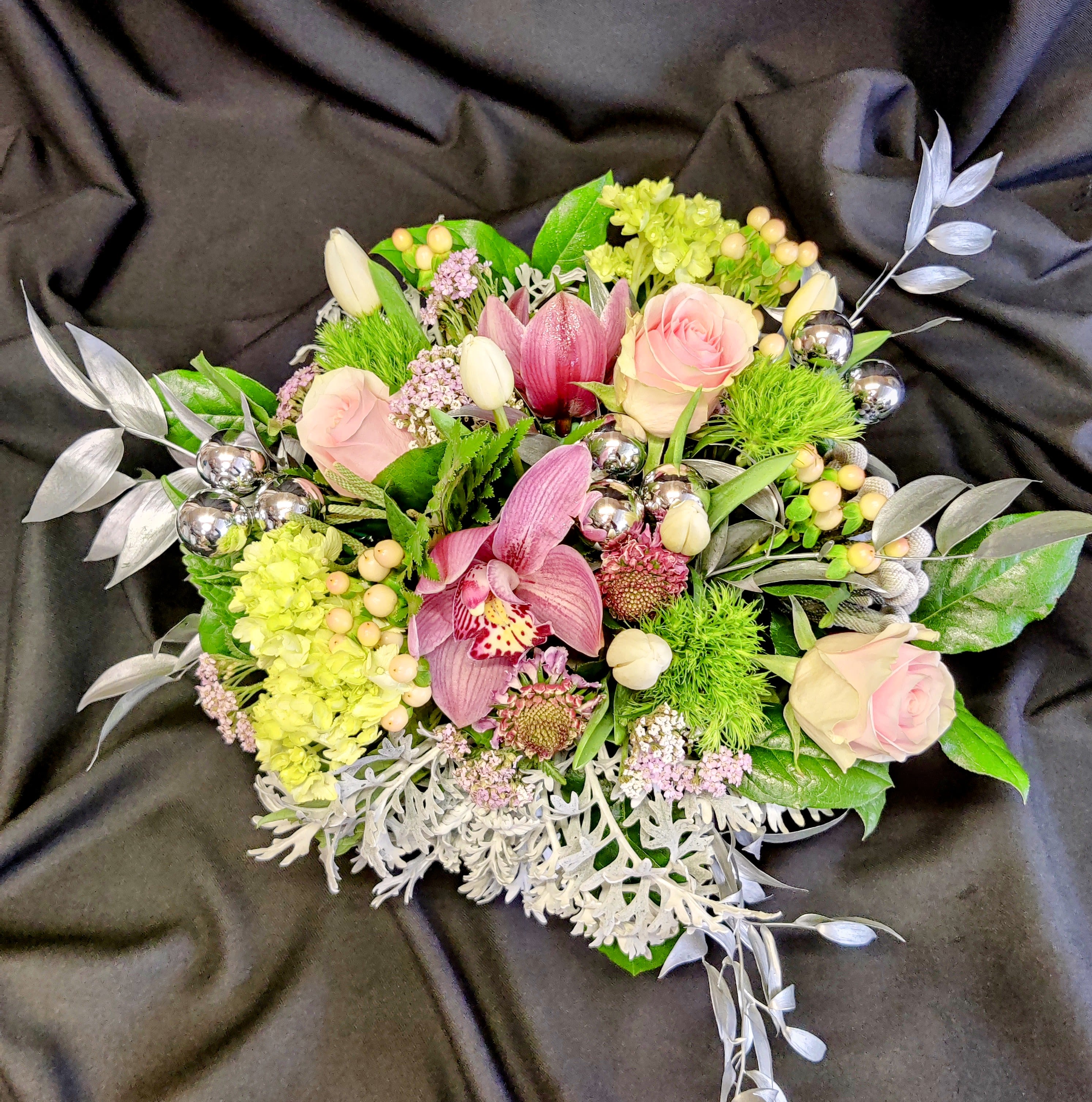 Holiday Pink Rose Centerpiece - Yes, feel free to choose a different main color when you order at least a week in advance. We will create a sweet medium size centerpiece suitable for a table of 4-6 guests. The deluxe and premium price points will be larger.