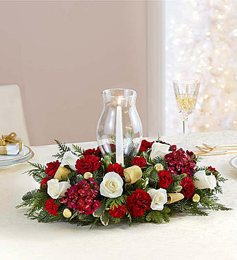  GLORIOUS CHRISTMAS CENTERPIECE - •Centerpiece arrangement with white roses; burgundy dianthus, carnations and mini carnations; assorted greenery; accented with gold ornament balls and ribbon