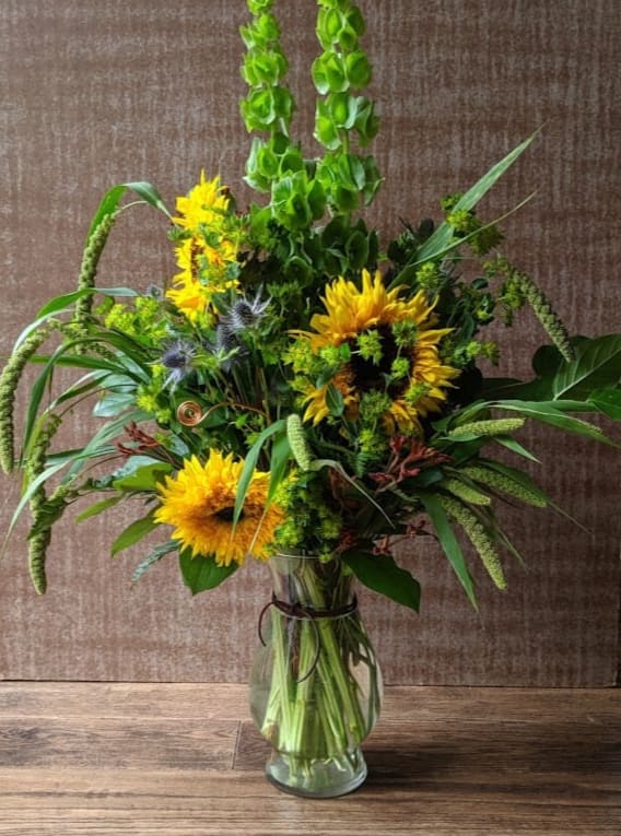 Autumn Orchard  - Lush greens and flowing grasses support a cast of sunflowers and late summer accents. Bring your own sunshine!