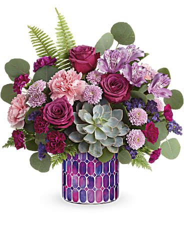 Bedazzling Beauty - Purple alstroemeria, pink carnations, miniature purple carnations, lavender button spray chrysanthemums and purple sinuata statice are arranged with sword fern, leatherleaf fern, and silver dollar eucalyptus. Delivered in Teleflora's Bedazzling Beauty cylinder. 