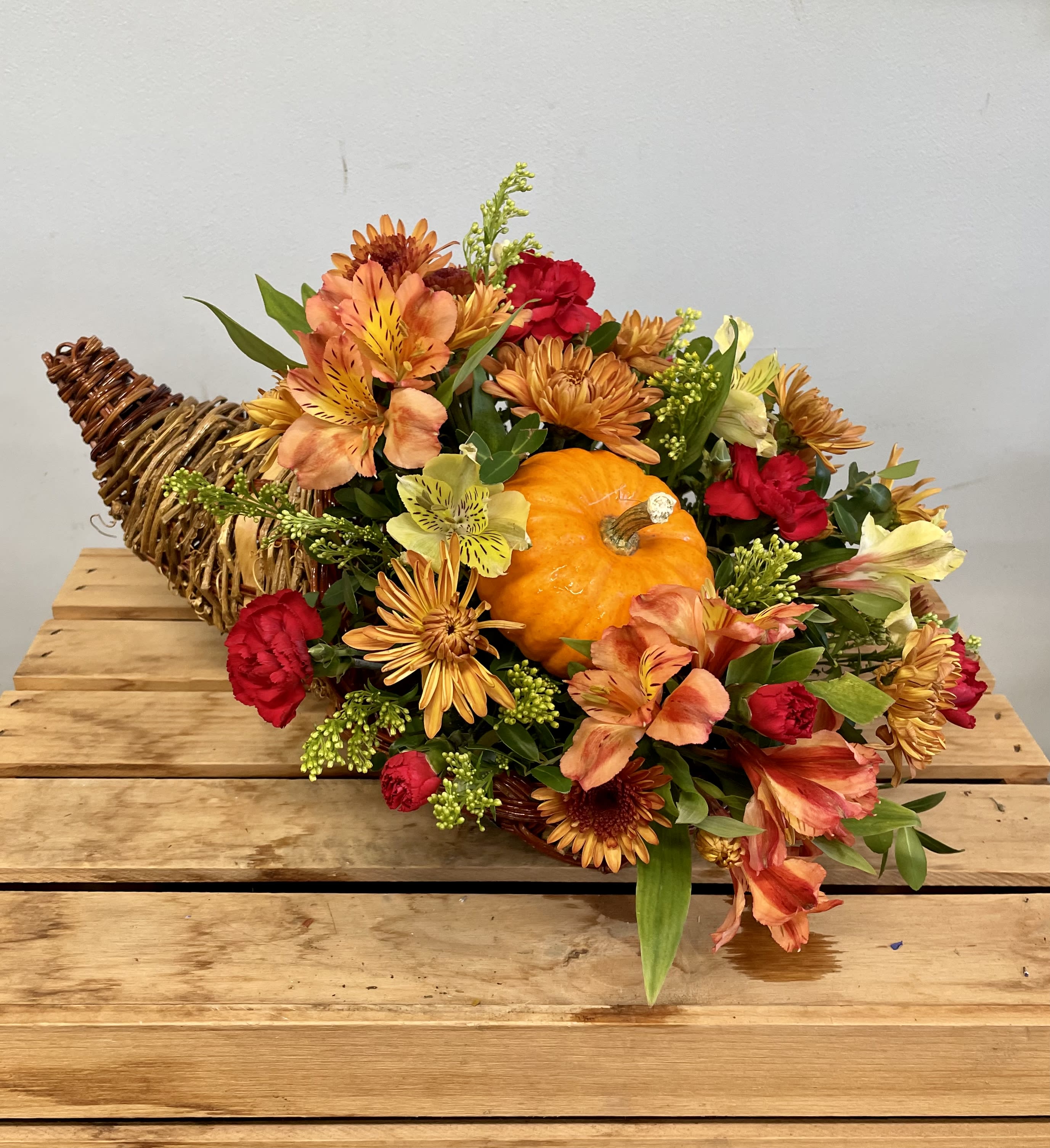 Small Cornucopia Centerpiece   - A festive gift to send to family and loved ones this Thanksgiving season. It’s the Perfect addition to their dining table and thanksgiving spread. Even includes a real pumpkin!