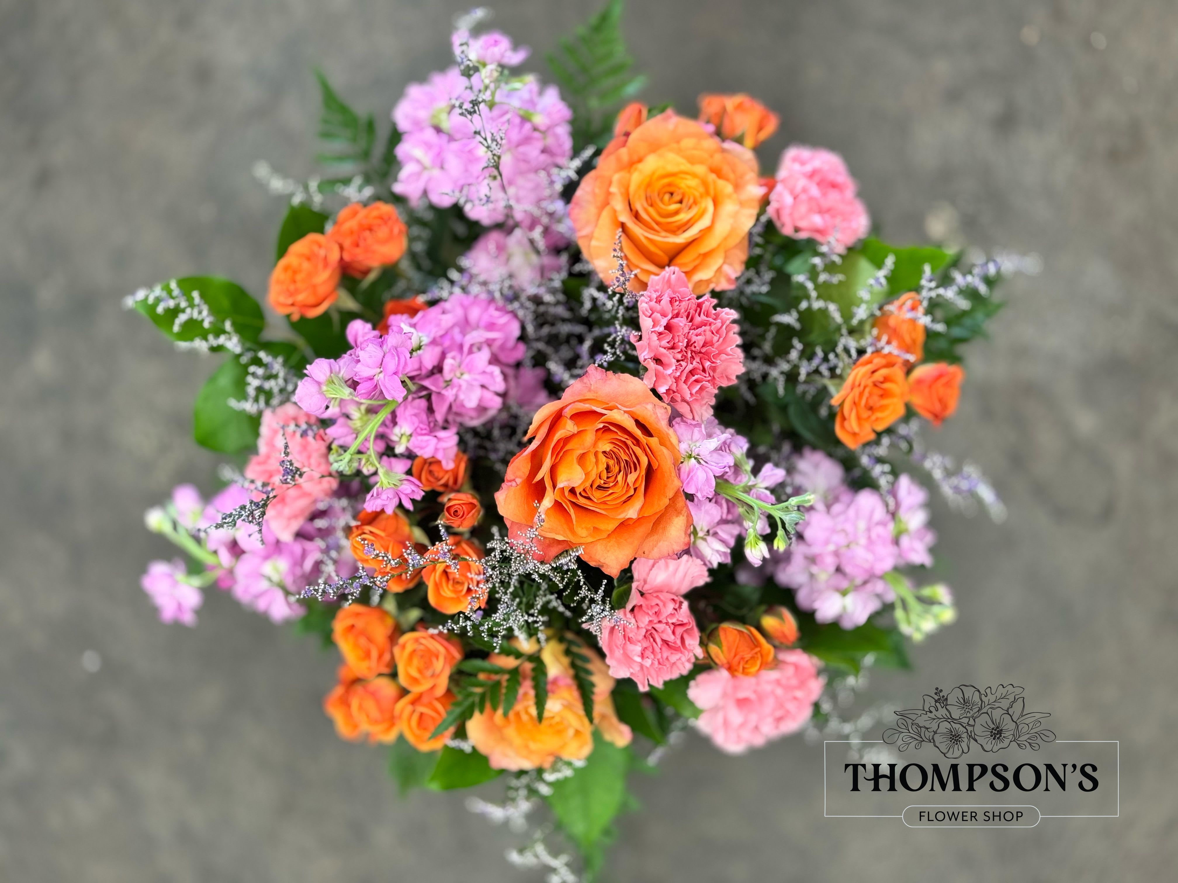 Life of the Party - Celebrate good times with this lively bouquet. The arrangement includes roses, carnations and stock.  