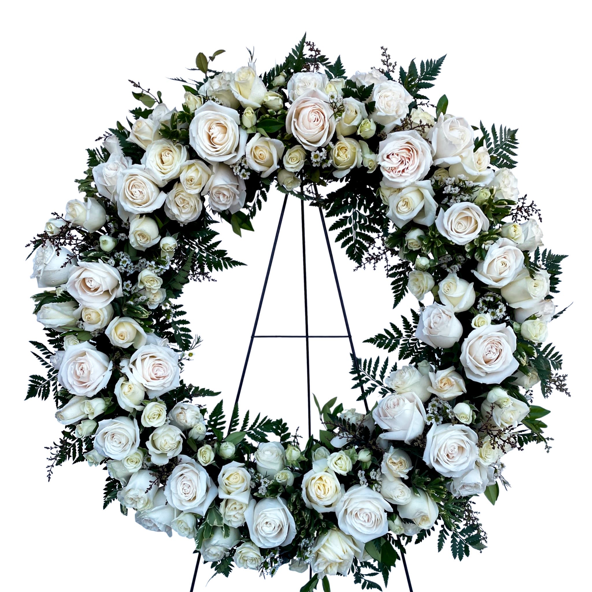 Rose Wreath - Celebrate the eternal grace of a life well lived with this classic wreath of peaceful white roses.