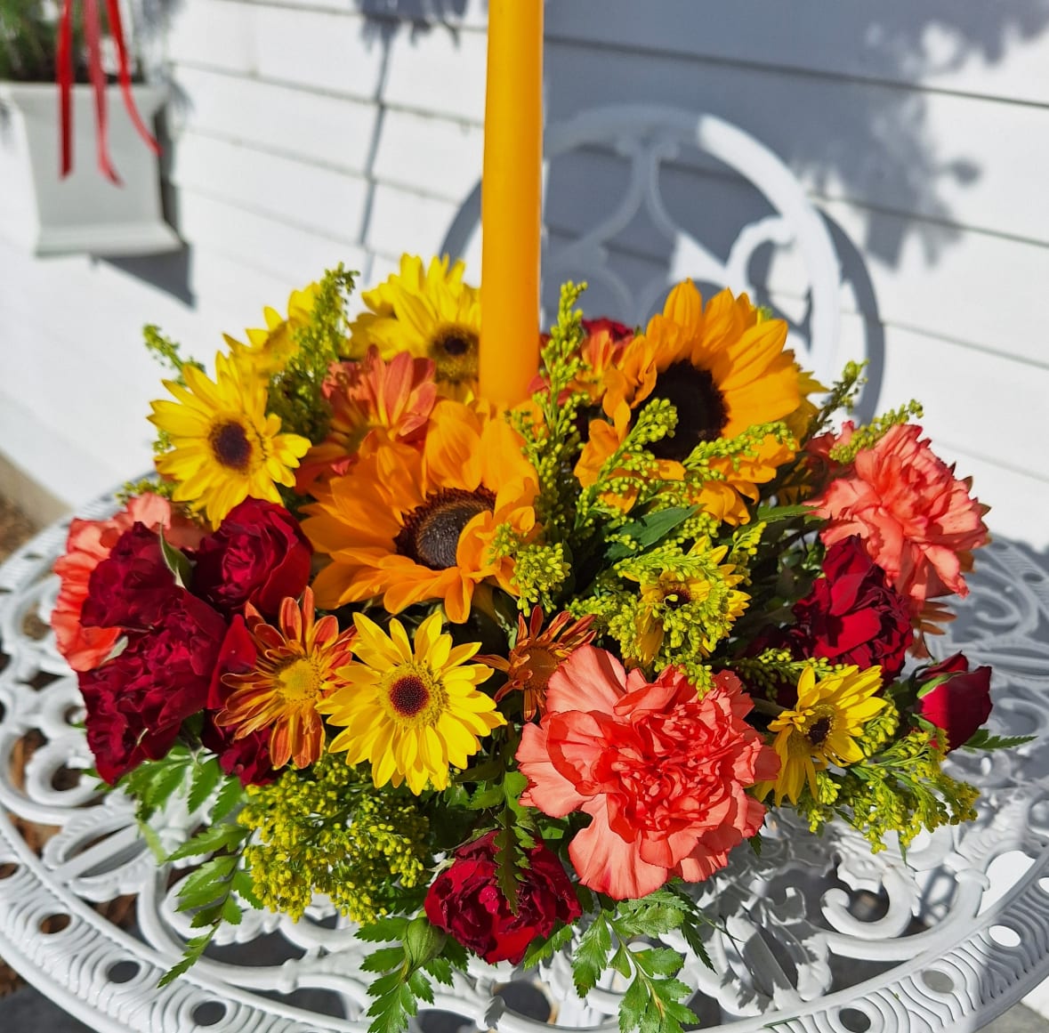 Autumn Centerpiece - Single Candle centerpiece with sunflowers, spray roses, daisies, carnations and solidago