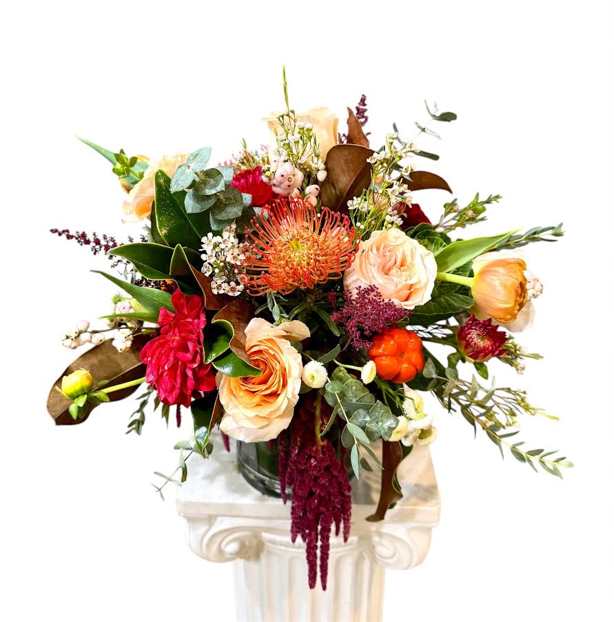 Treasures Bouquet - Roses, protea, astilbe, hydrangeas, autumn flowers with greens in a Vase Flowers that are high quality, fresh, and beautiful. While we may seasonally need to substitute for flower variety also we may sometimes need to use a different vase or different greens for sub material.