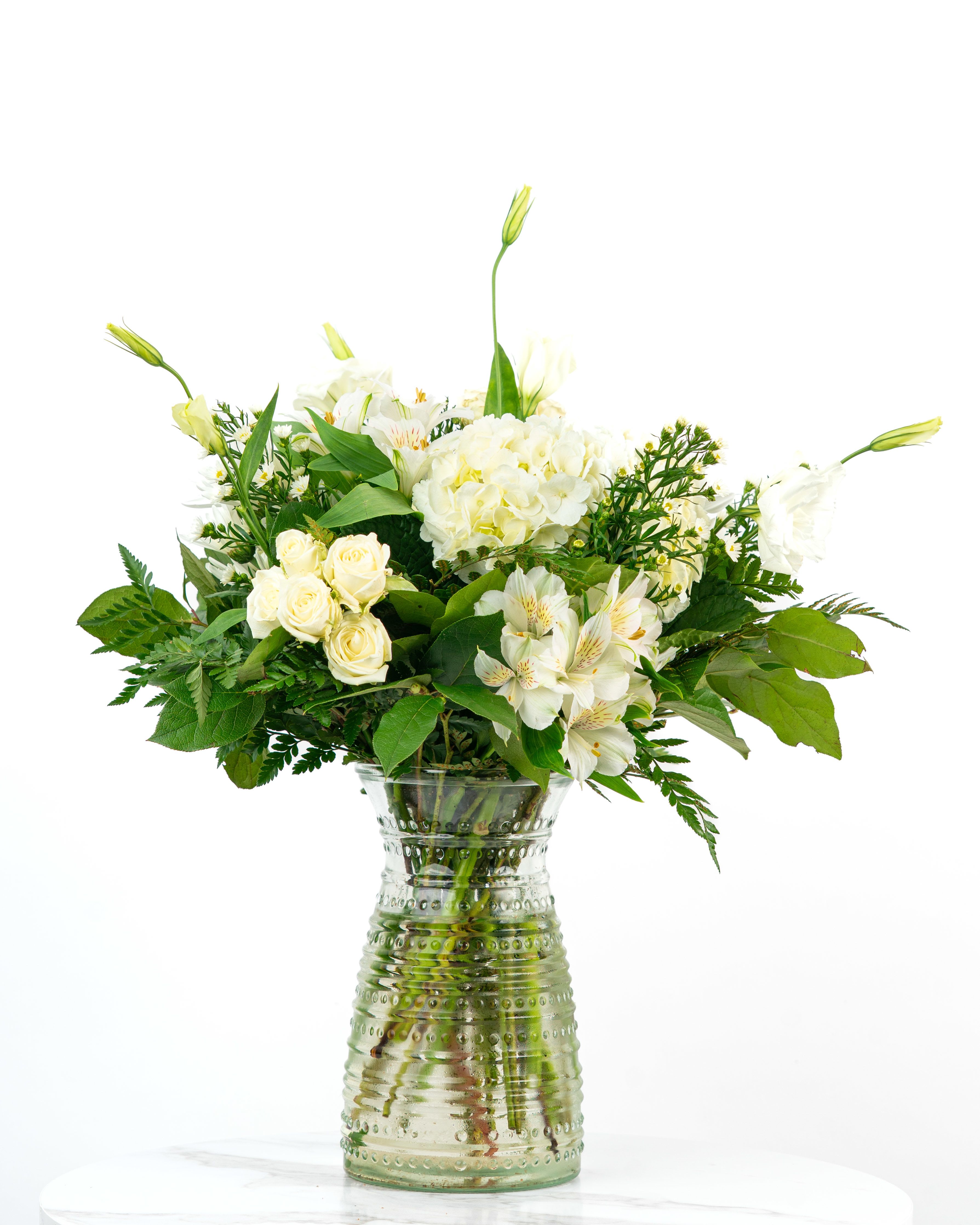 Our Timeless Collection: White Blooms - Our Timeless Collection's White Blooms features elegant blooms in soft ivory and/or white hues to evoke lasting beauty and classic romance. This classic floral arrangement is intended to celebrate someone special with timeless beauty and style. At Schultz Floral, each arrangement is one of a kind and styled just for your order. Because we always use the freshest blooms, your final arrangement may not look exactly as pictured due to seasonal availability.