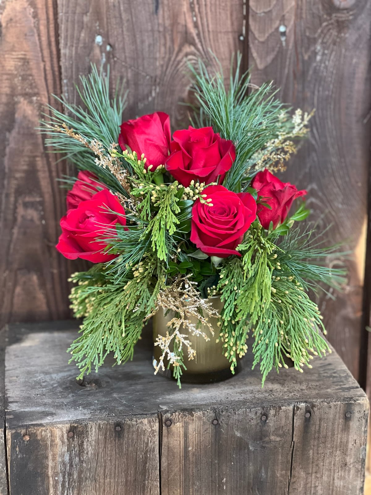 Glitter Gold and Red - Deep red roses accented with glitter and gold make this festive arrangement the center of attention. Add a little sparkle to the season with this stunning piece!