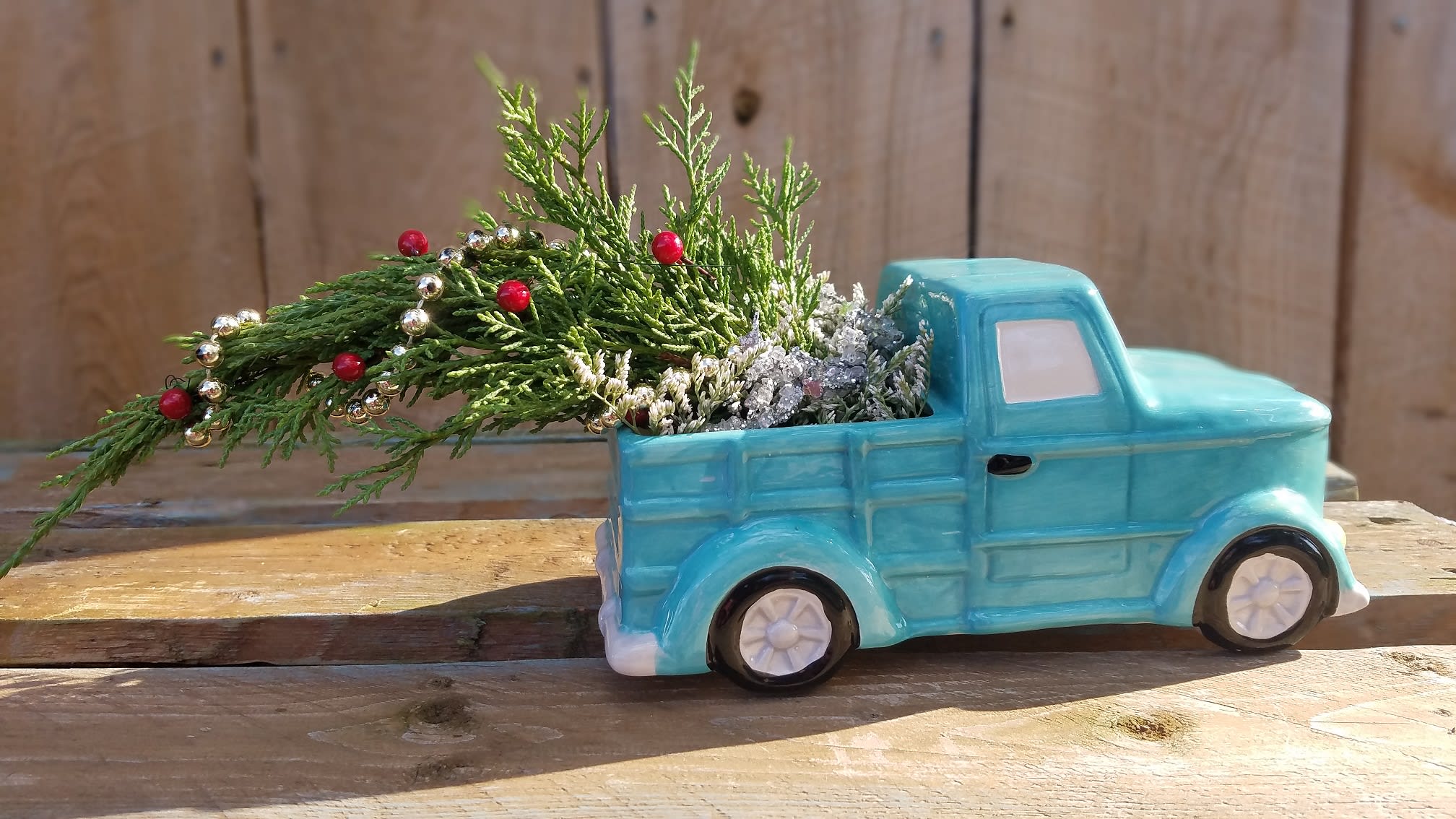 SALE: $29.99 Country Traditions - An adorable ceramic blue truck brings home a decorated Christmas Tree in the bed. This arrangement will bring back memories of a good old fashioned Christmas straight out of a Hallmark Movie! Black Friday Sale!