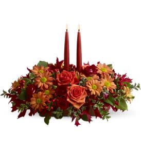 Autumn Lights - Let autumn lights glow at your Thanksgiving feast, and the holiday spirit will shine! Adorn the table with this lovely display of roses, daisy spray chrysanthemums and oak leaves arranged around two tall orange tapers, and dazzle family and friends.