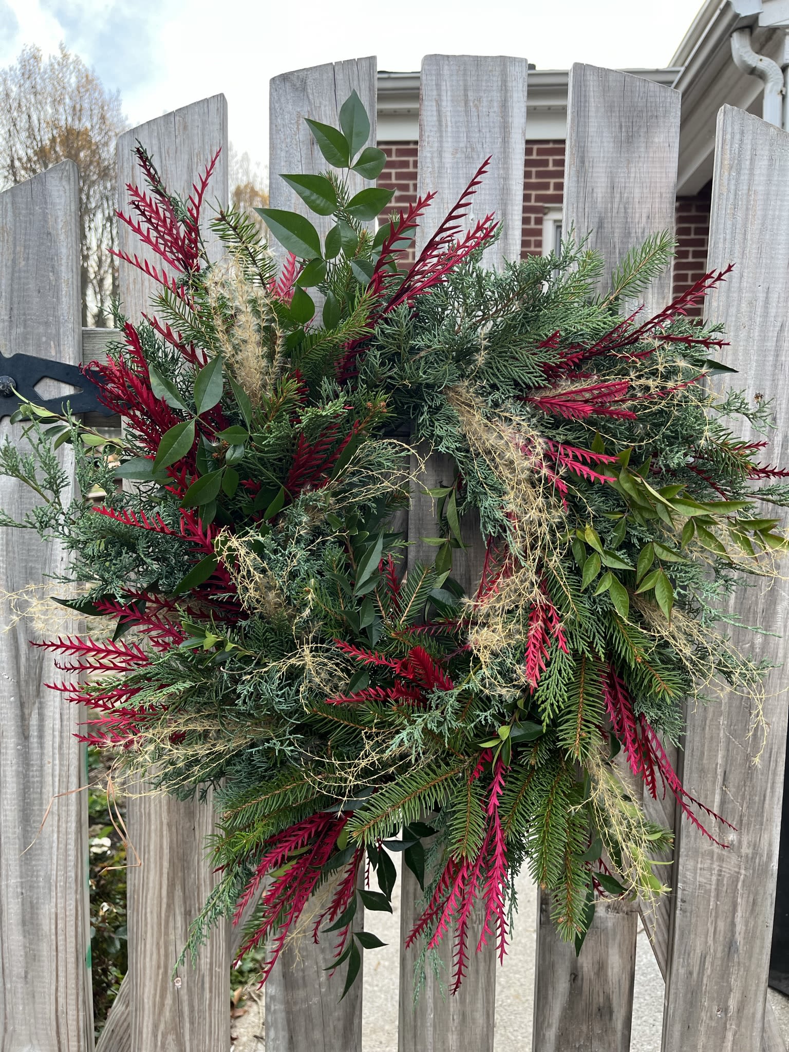 Full Evergreen Wreath - Sow Wonder wreaths are not pre-purchased forms.  They are custom made full wreaths on a 12-inch wire frame using a variety of evergreens along with seed pods, pinecone, berries, tinted ferns, and grasses.  All are outside and inside wreaths with a fresh evergreen smell.  The only qualification is that the wreaths like the cold so if you are hanging the wreath on a door that has the sun beating on it, the wreath will not last as long.    I begin making Evergreen after Nov. 23rd, please add to the notes anything you'd specifically like.  Please see my Glitter and Glitz Wreaths for a wreath with all the traditional balls, faux flowers and glitter sprays.  Thanks!