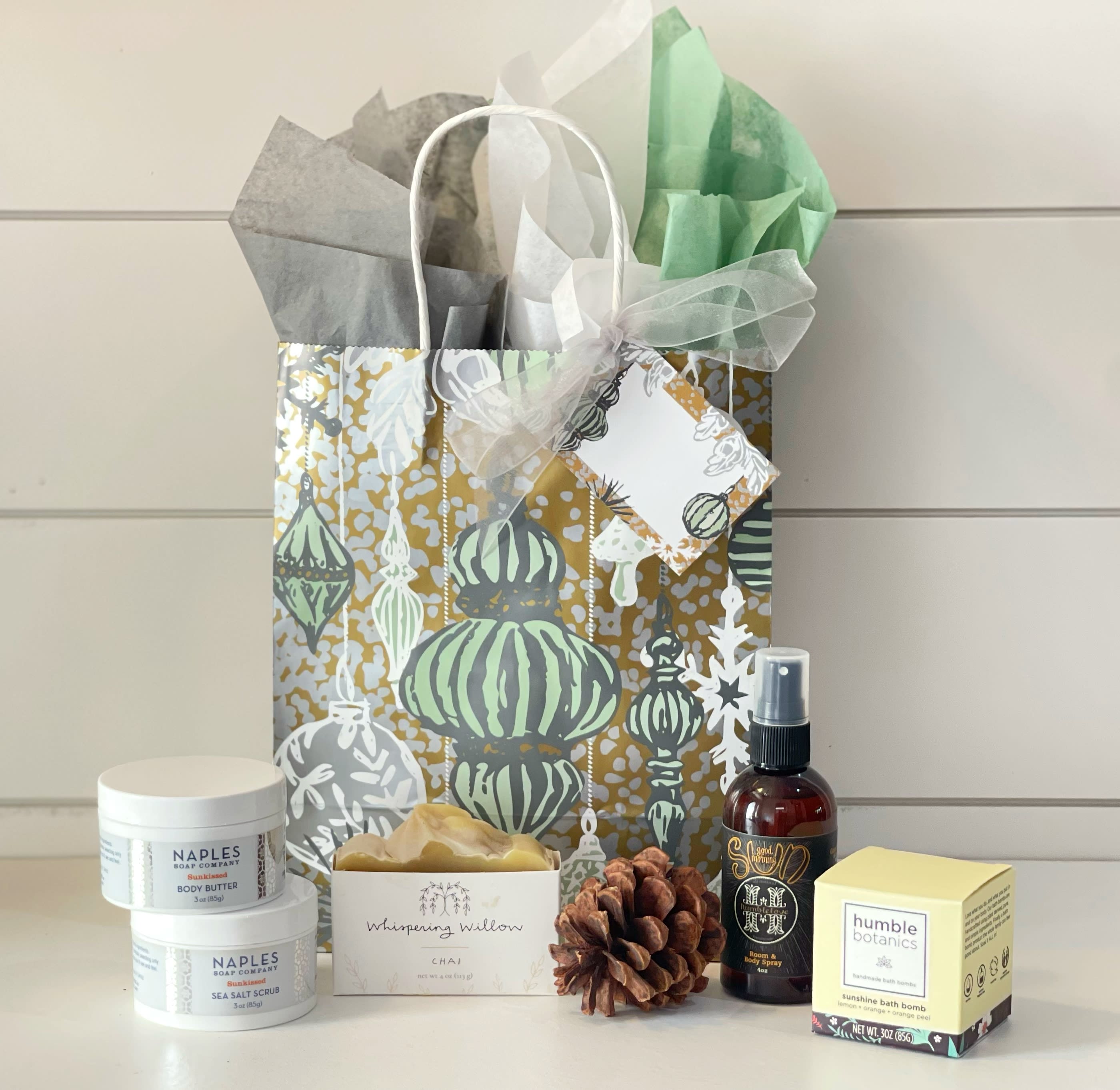 Pamper her for Christmas - Pamper her for Christmas with these perfect products that are not only indulgent, but are clean and chemical free with her health in mind: - Naples Soap Co. Sunkissed body butter - Naples Soap Co. Sunkissed sea salt scrub -Organic Chai bar soap from Whispering Willow. This soap is full of warmth and spiciness that evokes the coziness of Winter. The rich lather from their blend of organic oils, shea butter, and activated charcoal provides deep cleansing while moisturizing the skin and providing essential nutrients. -Humble Botanics Sunshine Bath Bomb. Instead of using harmful chemicals, dyes, and fragrances to achieve color and scent, Humble Organics has a non-toxic approach. They used dried orange peel, and organic orange and lemon essential oils. - Good Morning Sun room and body spray by Humble Love. A blend of mint and citrus specifically designed to help wake you up and keep you motivated. All in a beautiful Holiday gift bag