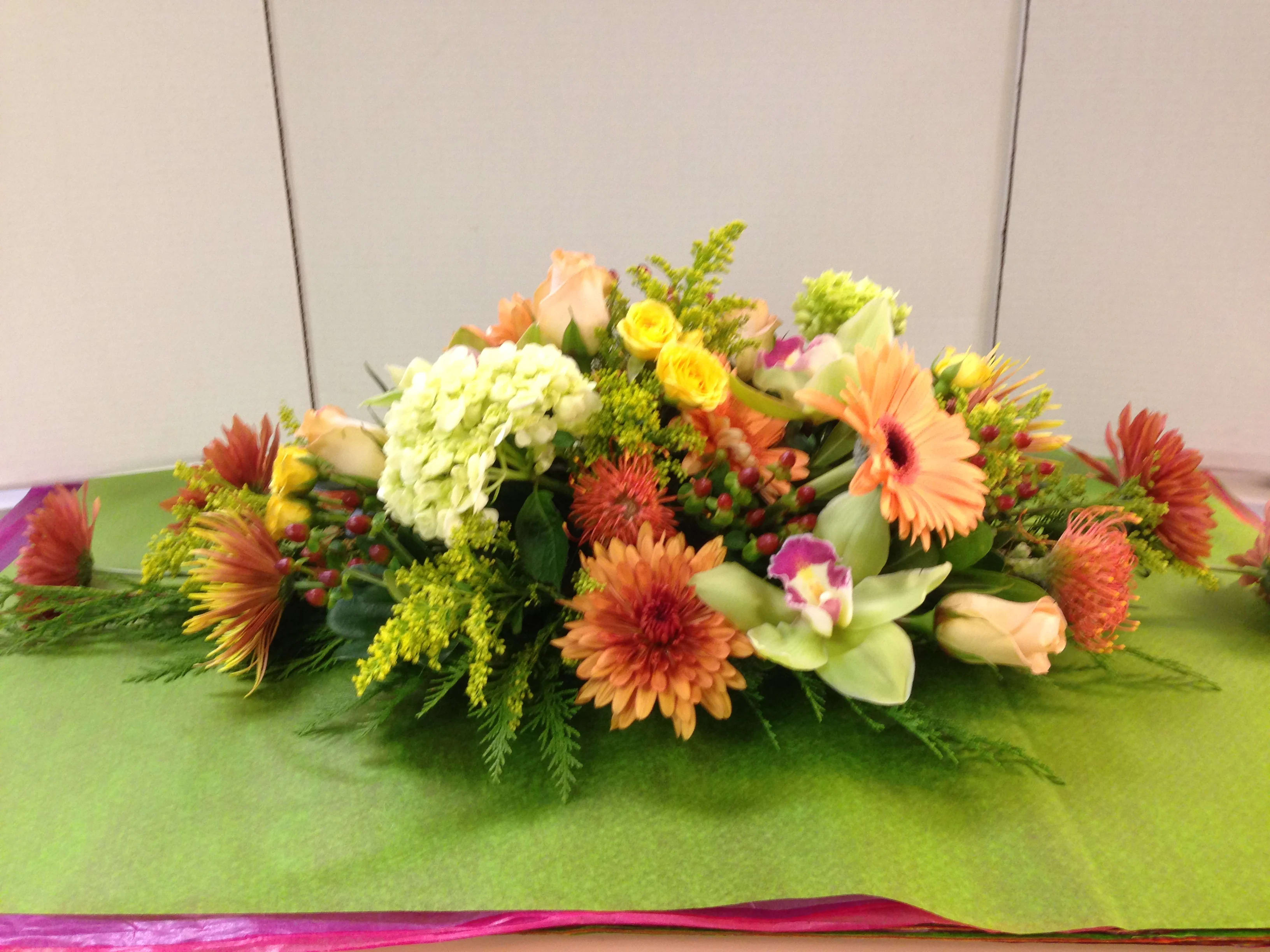 HOLIDAY CENTERPIECE(Pre-Order) - Assorted Roses, Assorted Lilies, Assorted Gerbera Daisies, Assorted Mums, Assorted Hydrangea,  Cymbidium Orchids, Protea, Solidago, Fancy Greens Call  with your details. 908-234-2900