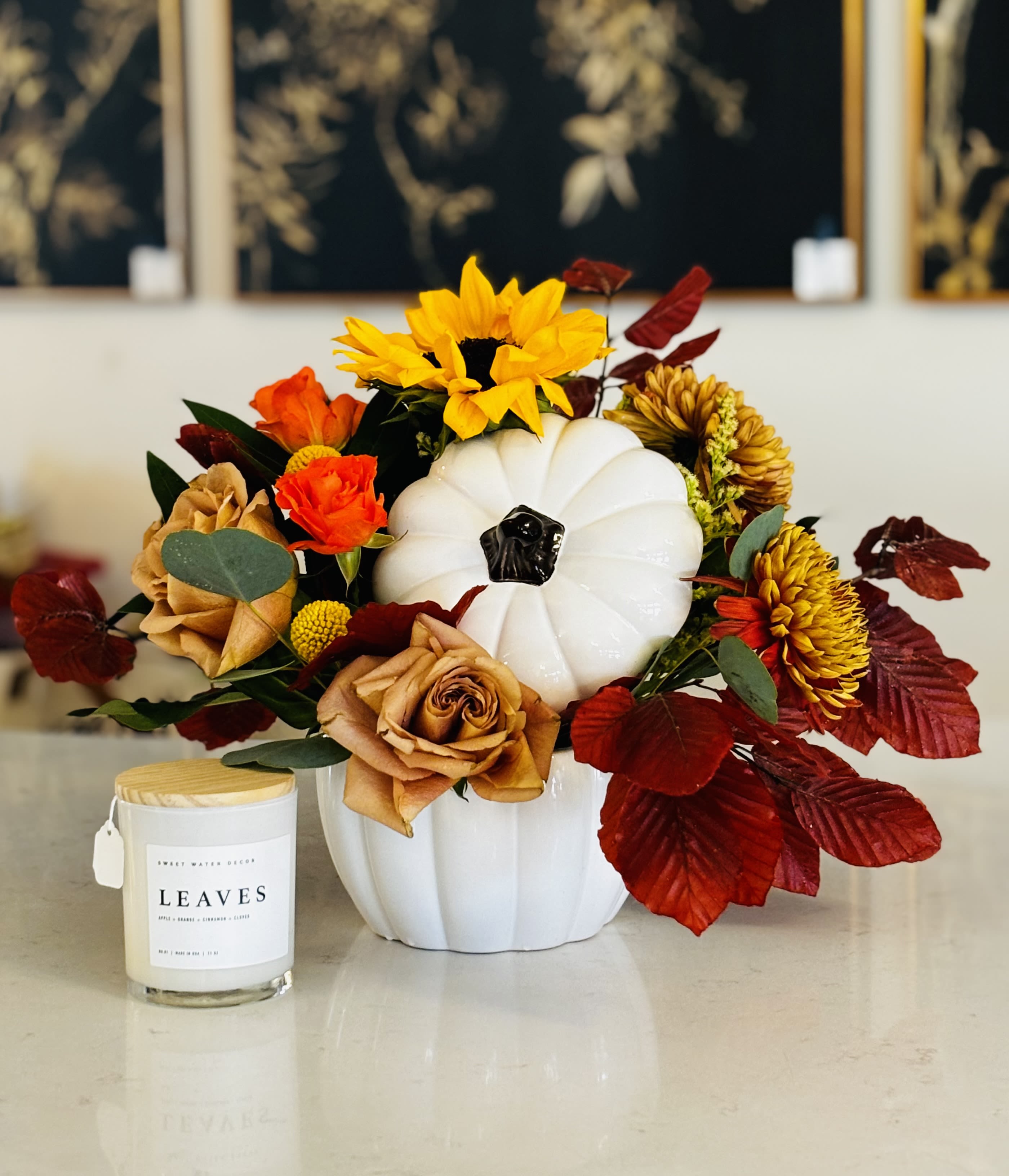 Home for the Holidays - Ceramic pumpkin keepsake, filled with autumnal floral and foliage.  Bundled with our LEAVES scented candle.  A great complement for any host or any family that you want to be with this holiday season.