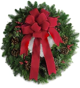 Classic Holiday Wreath - A beautiful noble fir wreath with juniper branches, pinecones and berry sprays is adorned with a brilliantly festive red velvet bow. Anyone would be delighted to have this arrive on their doorstep! Approximately 25" W x 26 1/4" H