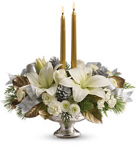 Silver And Gold Centerpiece - Inspired by the magic of the first snow, this elegant centerpiece of pure white lilies and winter greens, arranged in a stunning mercury glass bowl makes a fresh, fragrant addition to your holiday table, or a breathtaking gift for someone special.  This stunning arrangement includes white roses, white asiatic lilies, white miniature carnations, white button chrysanthemums, flat cedar, white pine and lemon leaf, accented with small silver pinecones, gold taper candles and silver ribbon. Delivered in an exclusive Mercury Glass bowl.   Approximately 16" W x 16" H  Orientation: All-Around  As Shown : TWR09-1A Deluxe : TWR09-1B Premium : TWR09-1C