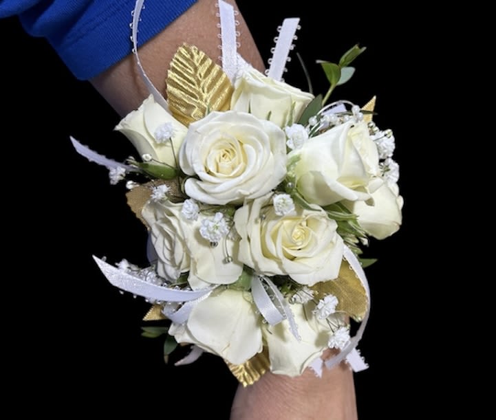 Ivory Elegance Corsage - An elegant corsage featuring all-white spray roses arranged with delicate baby’s breath and accented with silver dollar eucalyptus. Finished with white and gold ribbon, this design adds a touch of sophistication, making it perfect for proms, weddings, or special occasions.