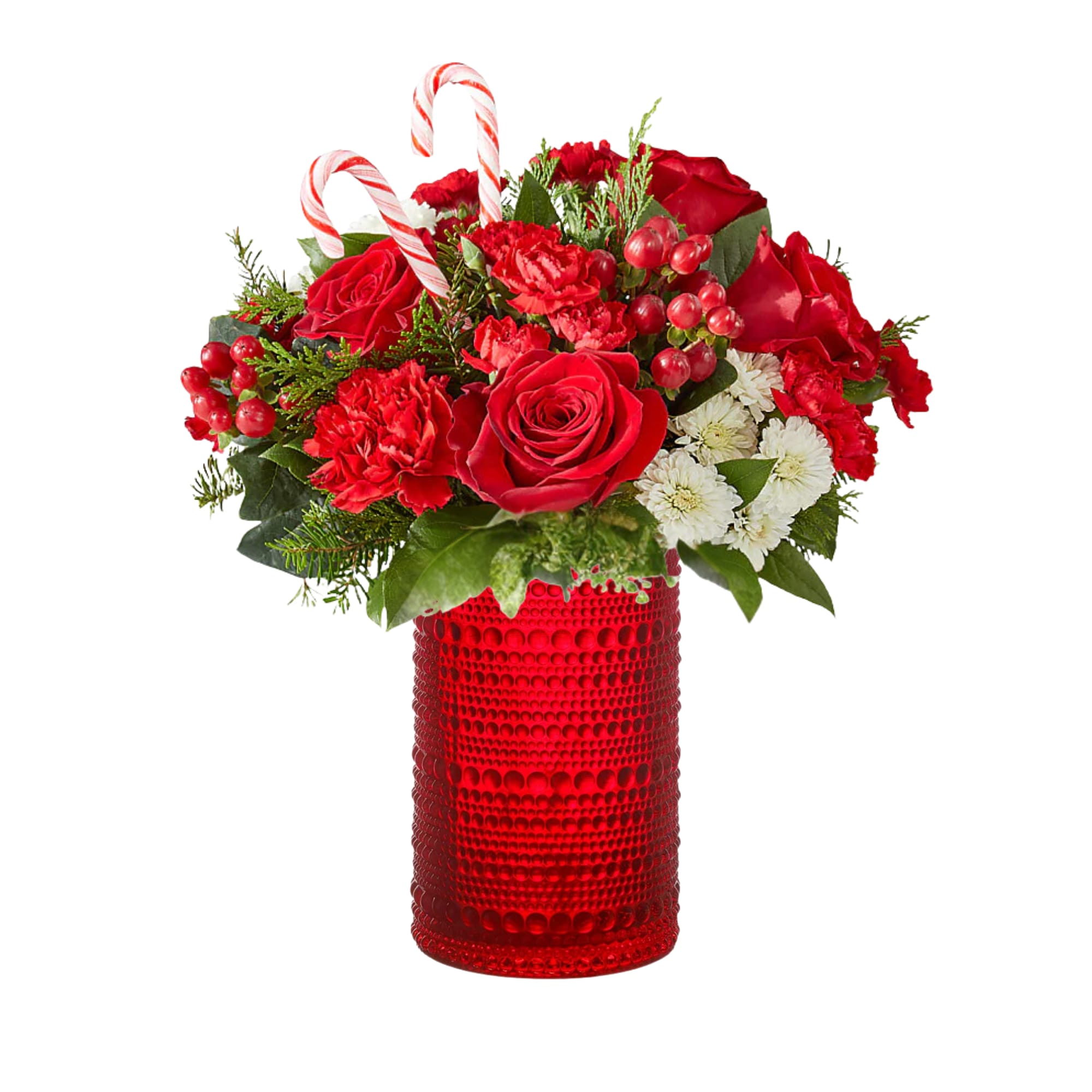 Candy Cane Cheer - Share the sweetness of the season with this holiday arrangement designed in a red textured glass,  filled with red blooms, winter greens, berries, and candy canes that capture the magic of Christmas. It’s the perfect way to brighten someone’s day, say “happy holidays,” or spread a little extra cheer to loved ones.