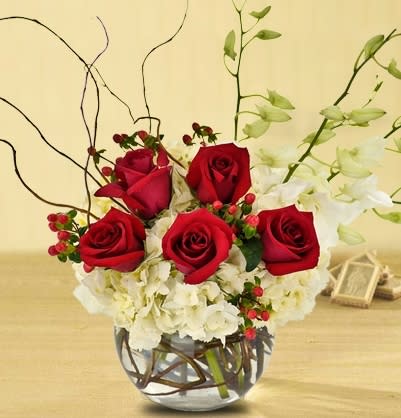 Ball of Christmas by Kokee - white hydrangeas that represent the pure snow, red roses the color  of  the Christmas.