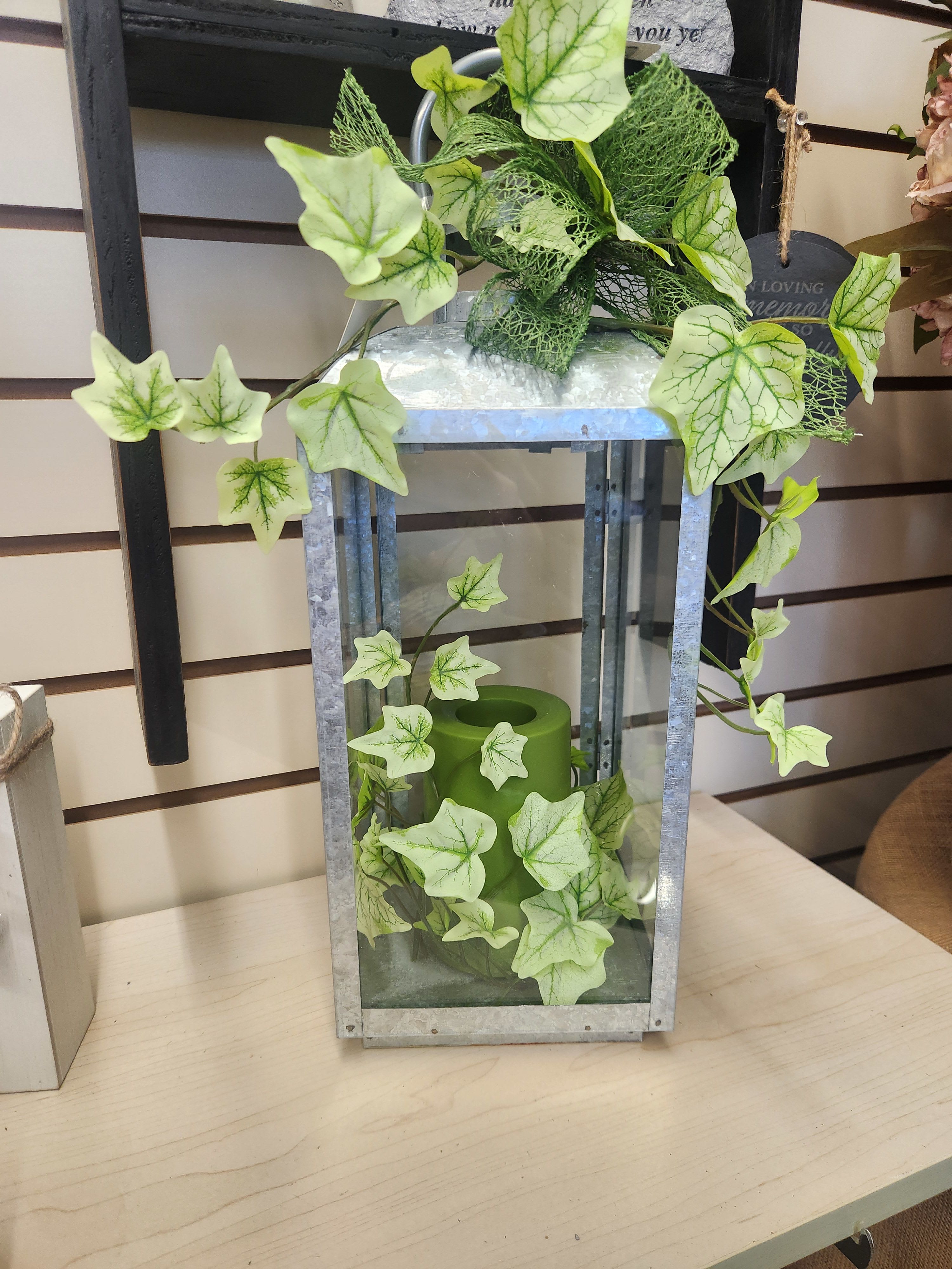 Galvanized memorial lantern - Galvanized memorial lantern with silk ivy and green battery-operated flickering candle.
