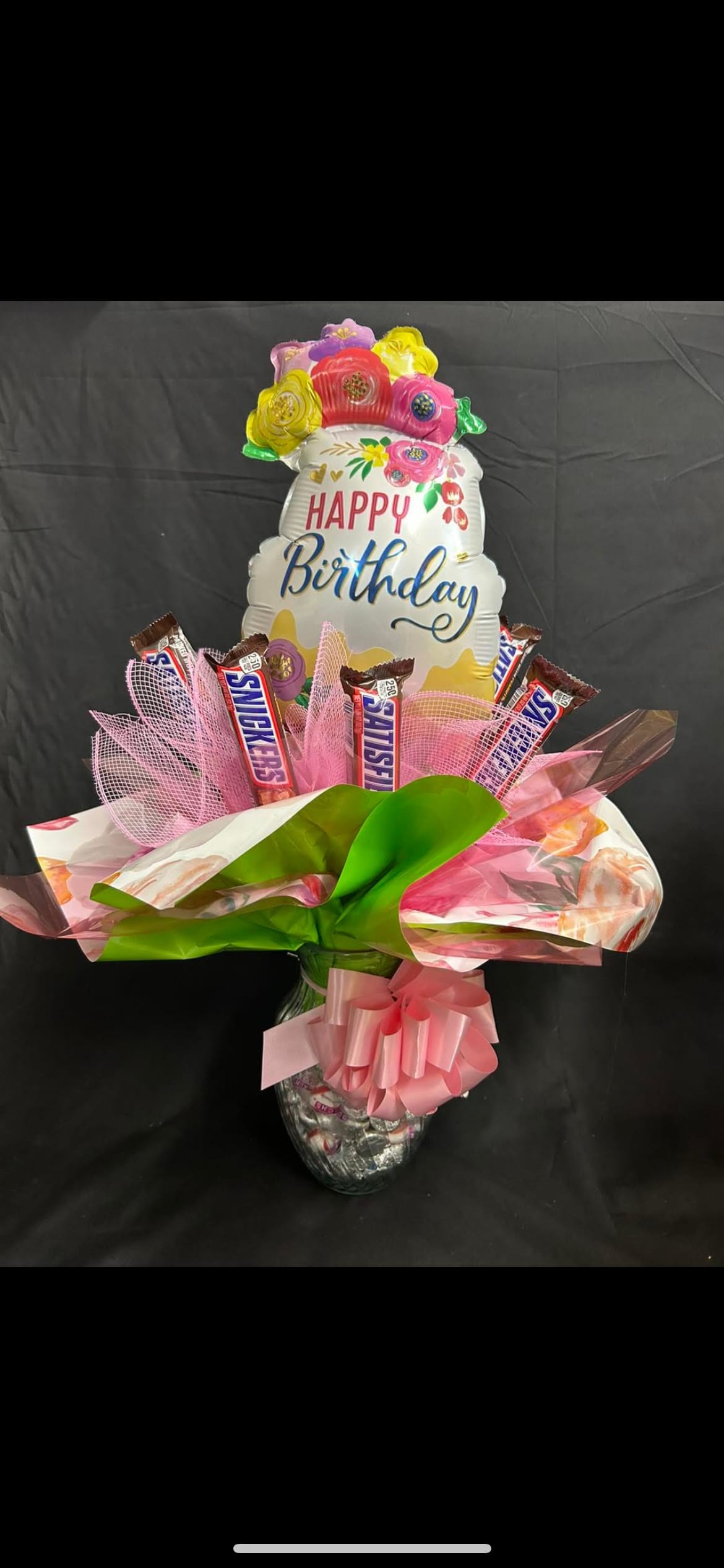 Birthday Candy Bouquet - A vase filled to the brim with delicious bite sized candy. Topped with full sized candy and a Balloon. Bound to bring a smile to anyone's face. *candy subject to change, please leave a special instruction if PEANUT ALLERGY*