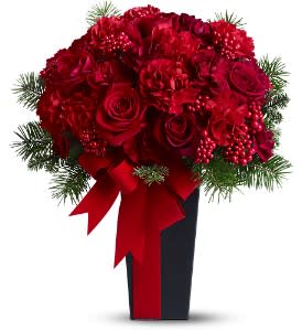 Christmas Concerto - We've captured the beauty of a Christmas concerto in this harmonious mix of scarlet-toned roses and carnations, mingled with tiny berries and fresh evergreens. A tall vase accented with a velvet ribbon creates a dramatic setting for this striking bouquet.  A mix of red roses and red and burgundy carnations - accented with faux berries, evergreens and a red velvet ribbon - is delivered in a vase.  Approximately 13&quot; (W) x 16&quot; (H)  Orientation: All-Around  As Shown : TFWEB469