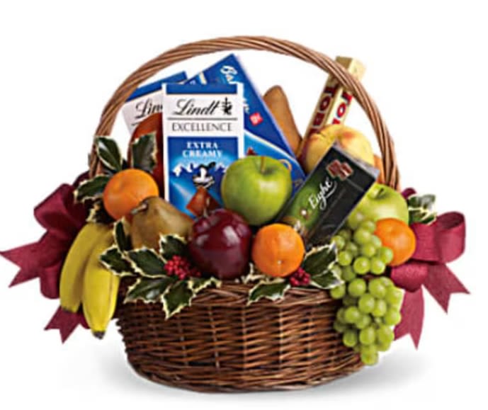Fall Cornucopia Basket - Cornucopia: An abundant supply of good things.  A bountiful gift basket that will please the health-nut and chocoholic alike! A delicious assortment of gourmet chocolates and fresh fruit are presented in a wrapped basket and decorated with fall ribbon. It's a mouth-watering choice for a corporate holiday gift, get well gift or thank-you gift! 4 apples, 2 bananas, 2 pears, 2 oranges, 3 tangerines and one bunch of green grapes are mixed with 4 gourmet chocolate bars and a box of cookies in a large handled basket. Orientation: N/A