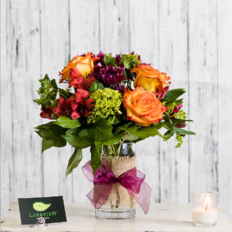 Festival - Tell them just how special they are to you with an extra- special arrangement of vibrant novelty roses, hydrangeas and alstroemeria.  It's sure to be a hit!  Approximate Dimensions: 13&quot; H x 10&quot; W