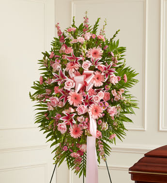 Deepest Sympathies Standing Spray - Pink - This Sympathy Standing Spray, in shades of pink, is a beautiful symbol of your sympathy and support. Pink flowers such as roses, stargazer lilies, larkspur, snapdragons and more An appropriate gift for family, friends and business associates to send directly to the funeral home 