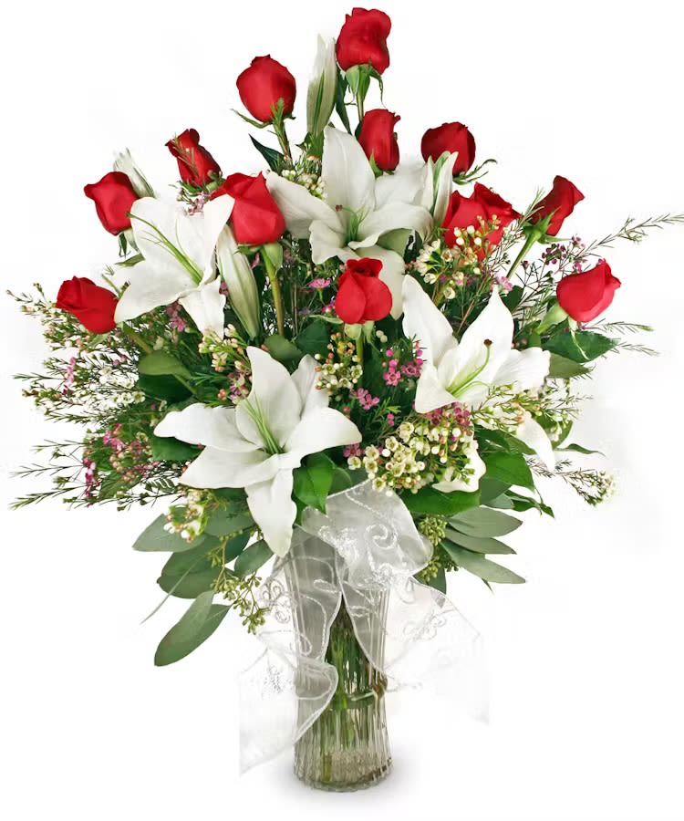 Remembering You in monday Morning - “Elegant and timeless, this arrangement of red roses and white lilies is a true classic.  Accented with delicate greenery and soft pink blossoms, it’s perfect for expressing love, admiration, or sympathy. A graceful addition to any occasion. 