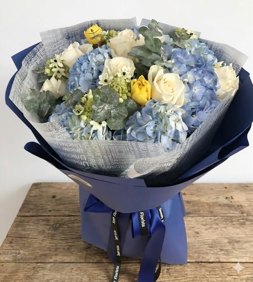 Ravishing - It's a simple but elegant display. The arrangement comes with ivory, soft yellow and blue color. 