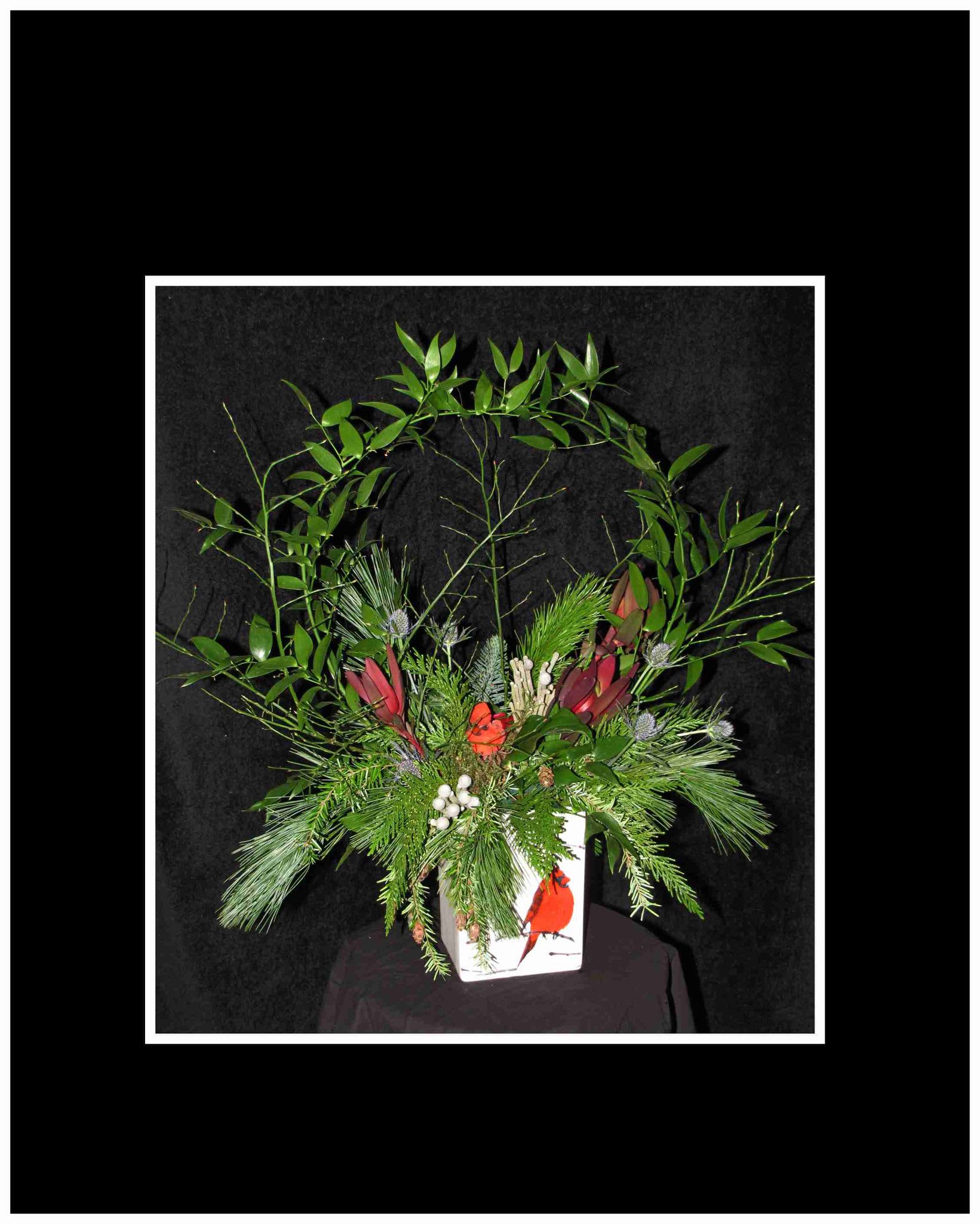 Winterscape Arrangement - An arrangement that truly depicts a Winterscape complete with a red cardinal  Approximately 22 H&quot; X 20 W&quot;