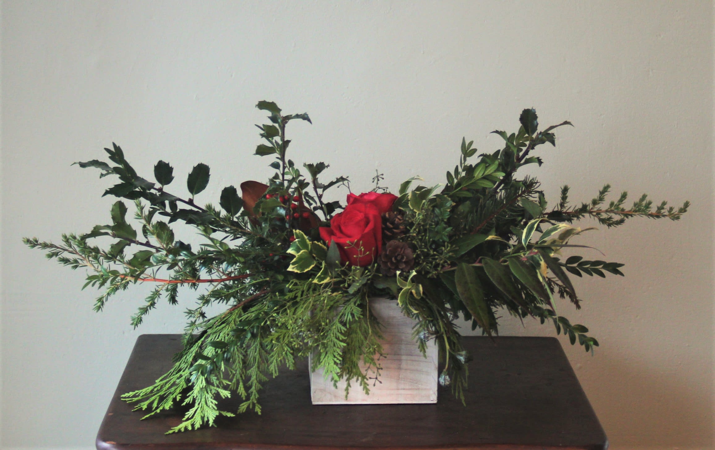 Holiday Square Box Arrangement - This box arrangement makes the perfect gift to someone (or yourself) for the holiday season. Fresh festive florals and greens will bring winter charm to whichever space it adorns!