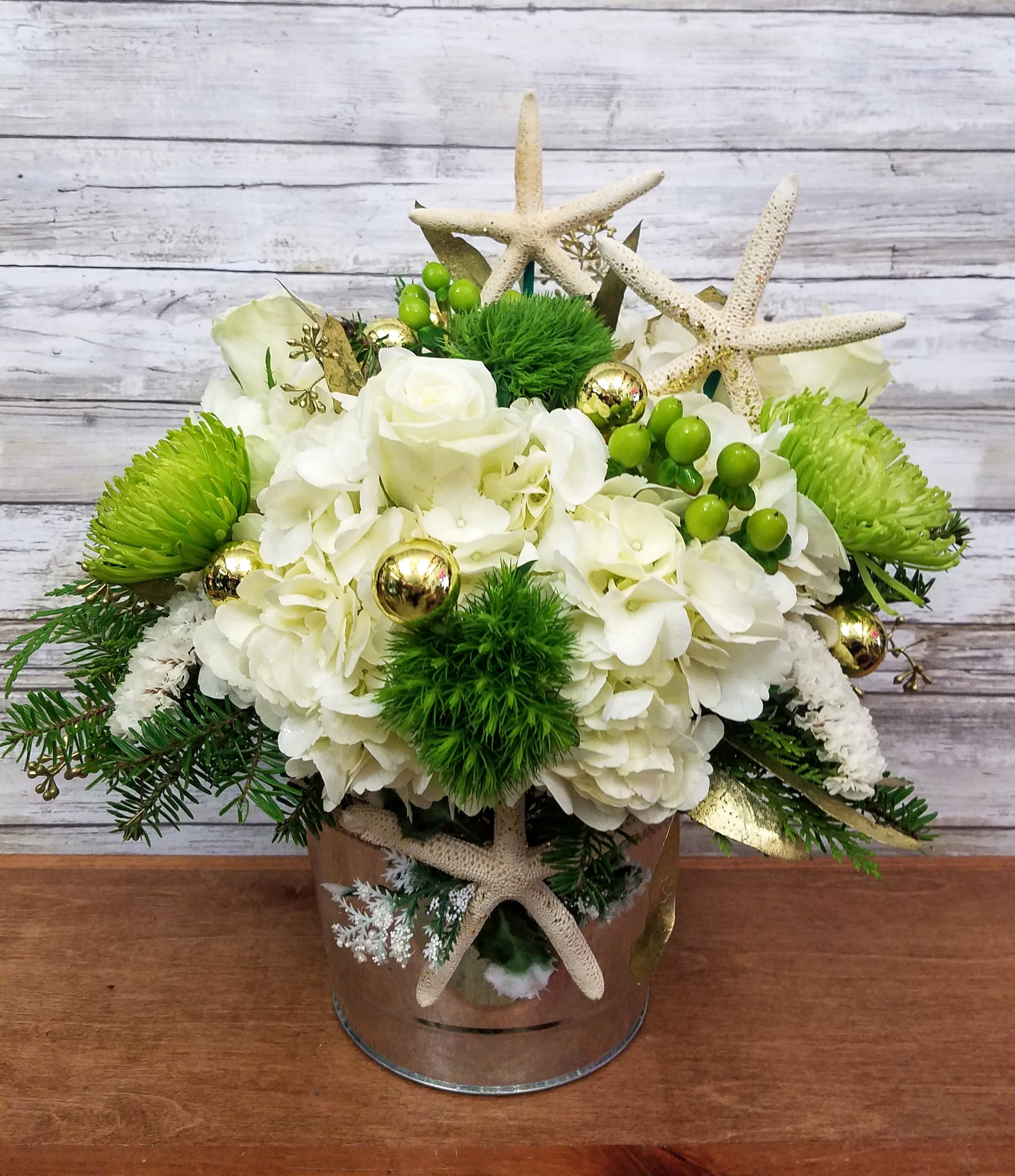 Coastal Holiday  - Send delightful holiday wishes in a starfish adorned galvanized pail. A perfect gift for the hostess who loves the shore.   Approximately 14&quot; Tall 