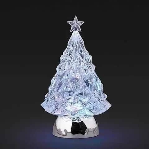 LED Light Up Shimmer Silver Tree Figurine - Add a white, elegant glow to any space with this faceted acrylic tree. Its crystal-like design, silver LED lights, and star topper create a beautiful shimmering effect. Finished with a metallic silver base, its perfect for mantels, desks, and holiday centerpieces.  5&quot; W. x 5&quot; D. x 9&quot; H.  Lights up. On/Off Switch, Comes with USB Port and USB Cable, Requires 3 AA Batteries