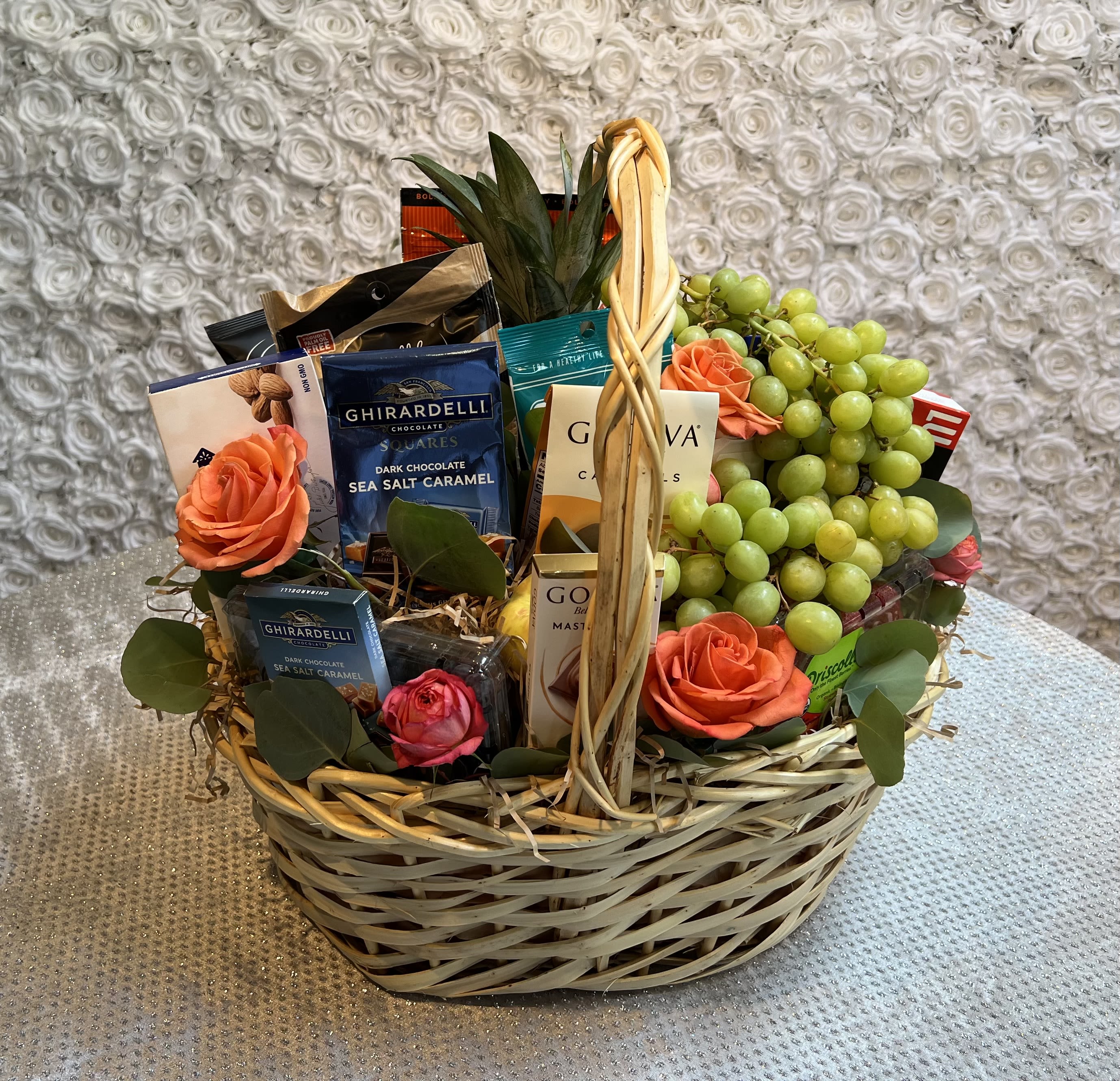 Fresh &amp; Fancy Gourmet Basket - The Fresh &amp; Fancy Gourmet Basket is the perfect gift when sharing gratitude, love, or sympathy. It holds all kinds of fresh fruit - from apples and pears to bananas and oranges - gourmet chocolates and cookies, cheeses, sausages, crackers and more. Plus, it's all wrapped and ribboned in a big delightful basket. 
