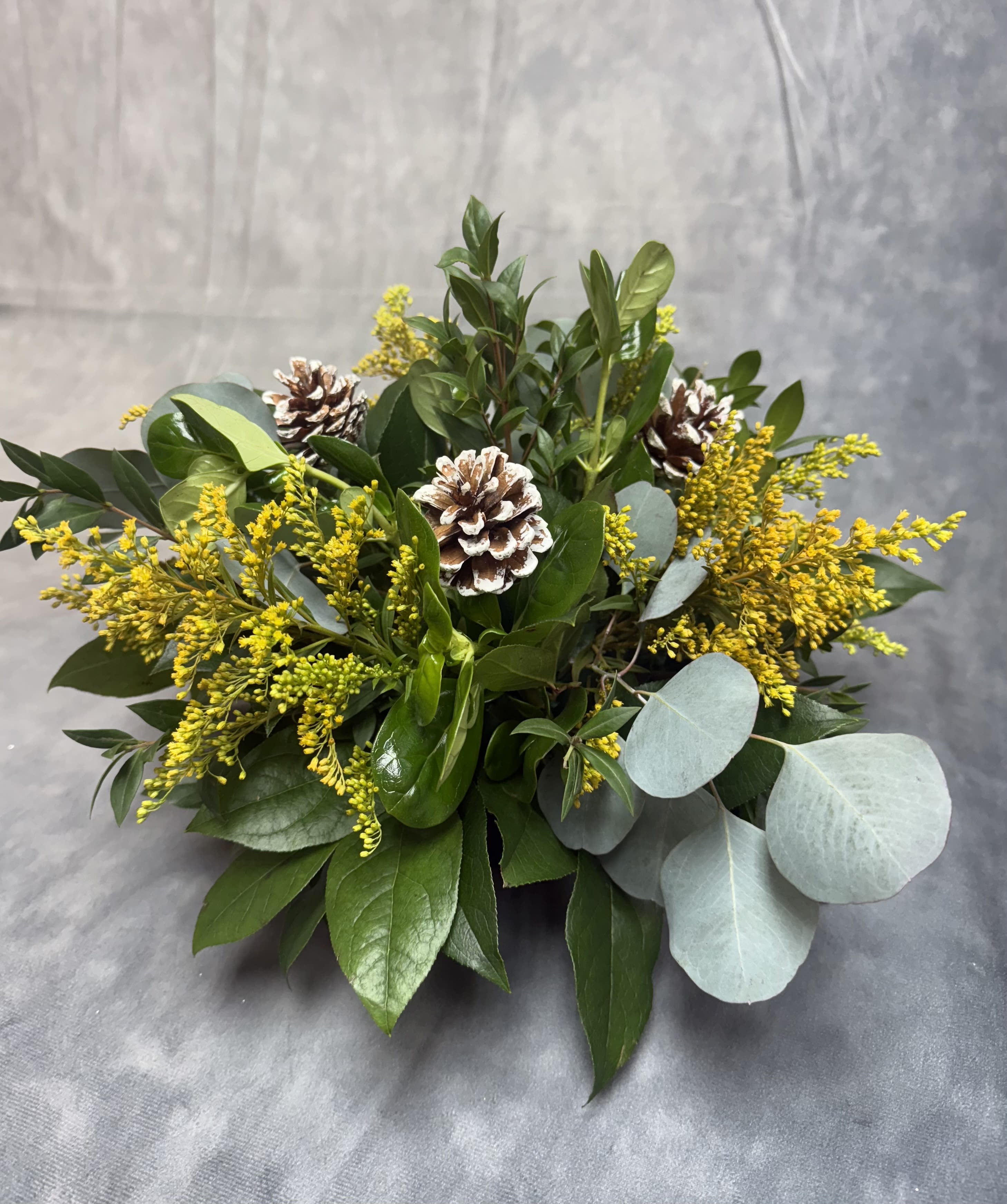 Pine cone fall centerpiece  - Create a warm , rustic touch for your autumn table with this handcrafted fresh fall centerpiece. Designed with pine cones , seasonal greenery and touches of warm harvest colors , this arrangement brings the cozy feel of fall indoors . Perfect for Thanksgiving tables , coffee tables or entry displays , this centerpiece add an earthy and a a welcoming seasonal glow to any space .