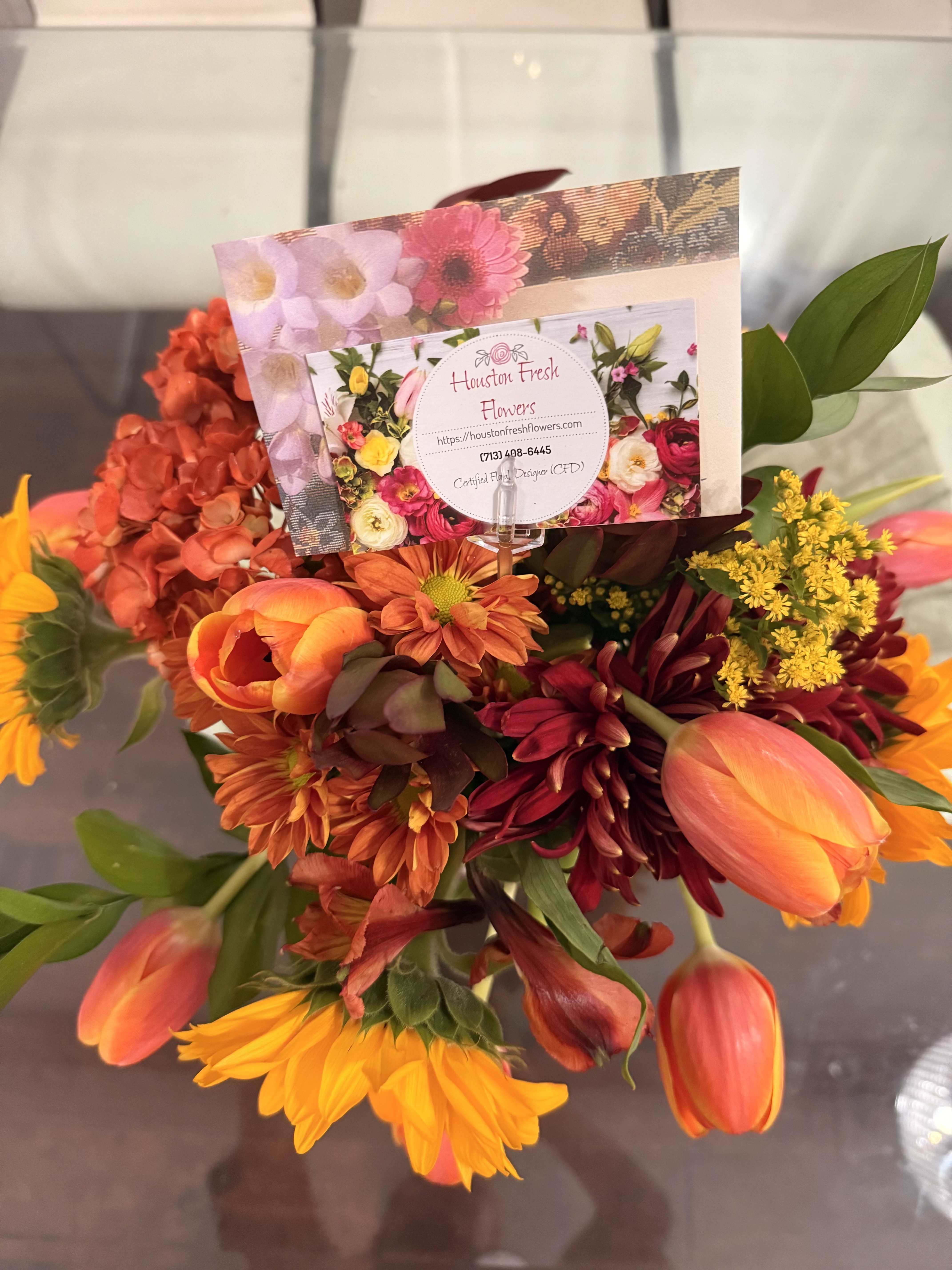 Autumn Radiance - This is a vibrant fall-inspired arrangement that radiates warmth and coziness. The palette mirrors the richness of Autumn- glowing yellow and orange, evoking the beauty of falling leaves and golden sunsets. It gives feels both rustic and elegant, perfect for brightening a seasonal table or gifting as a token of joy.