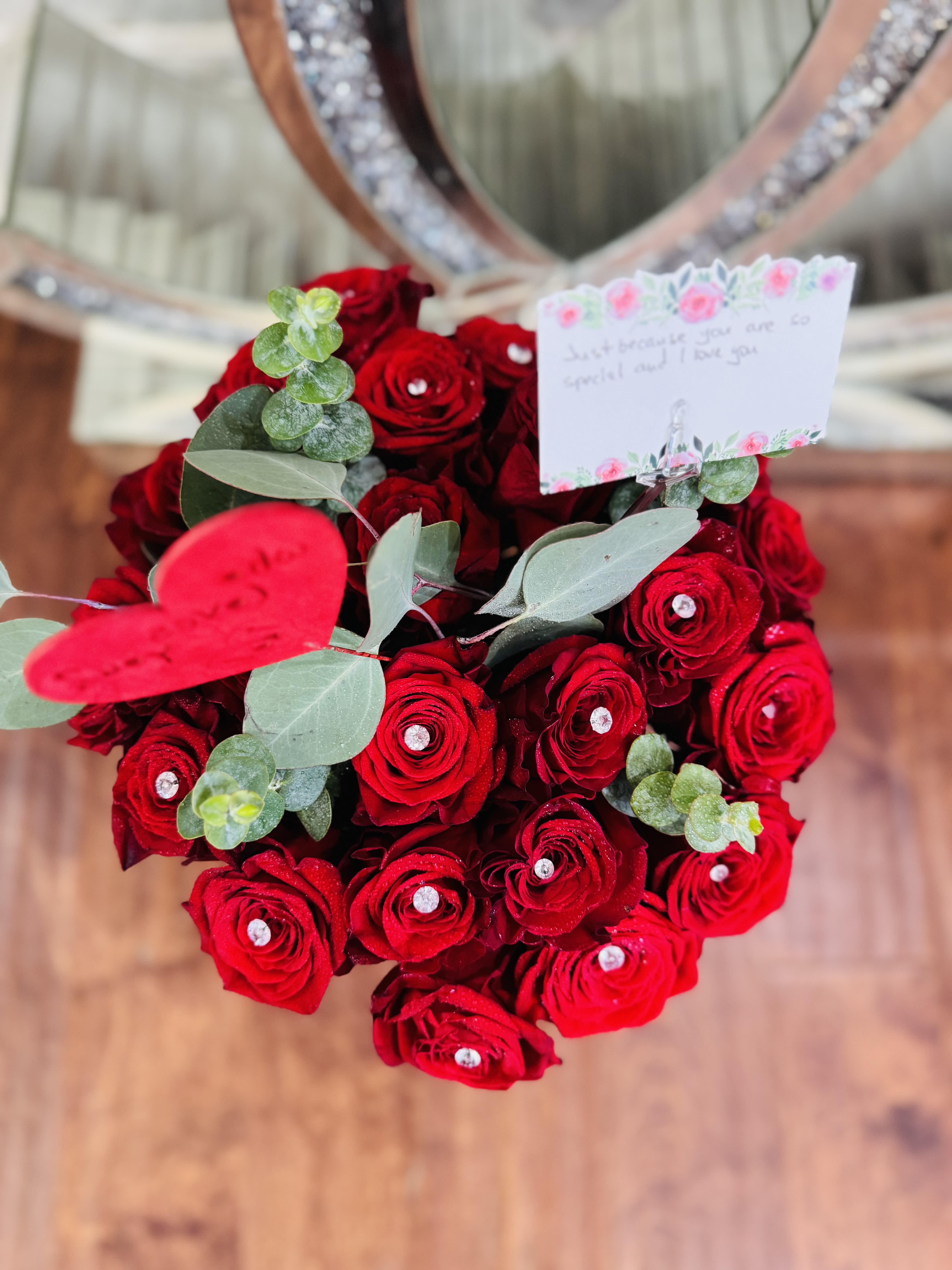 Red is forever - Standard- Dozen Roses Deluxe-2 Dozen Roses Premium-3 Dozen Roses A classic yet contemporary rose arrangement with eucalyptus for any occasion and any love.