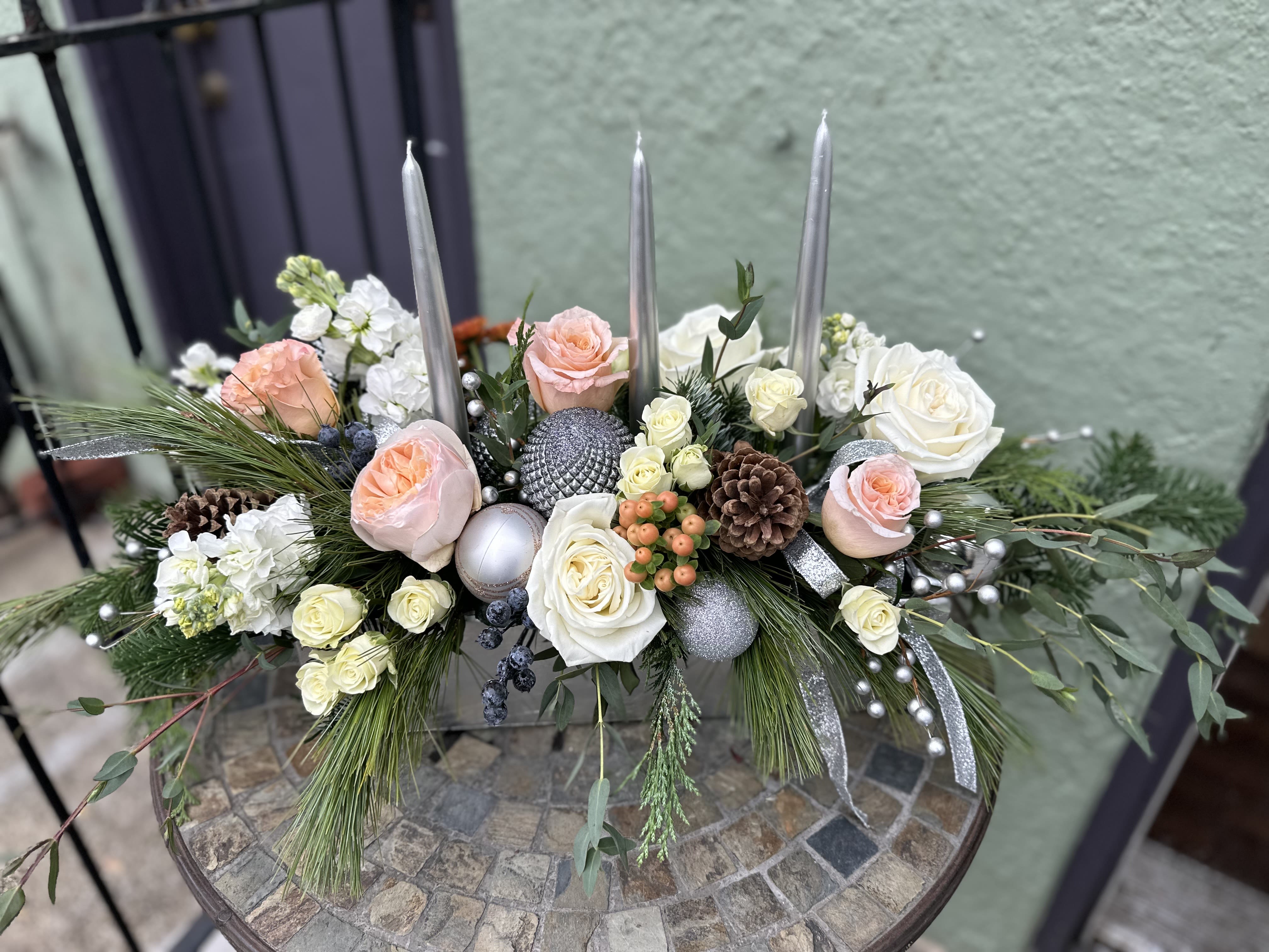 Snow Queen - Beautiful and romantic centerpiece for holiday table, or even anniversary, in silver long rectangle ceramic, with silver taper candles and ornaments. Designed with garden roses in white and peach elegantly.