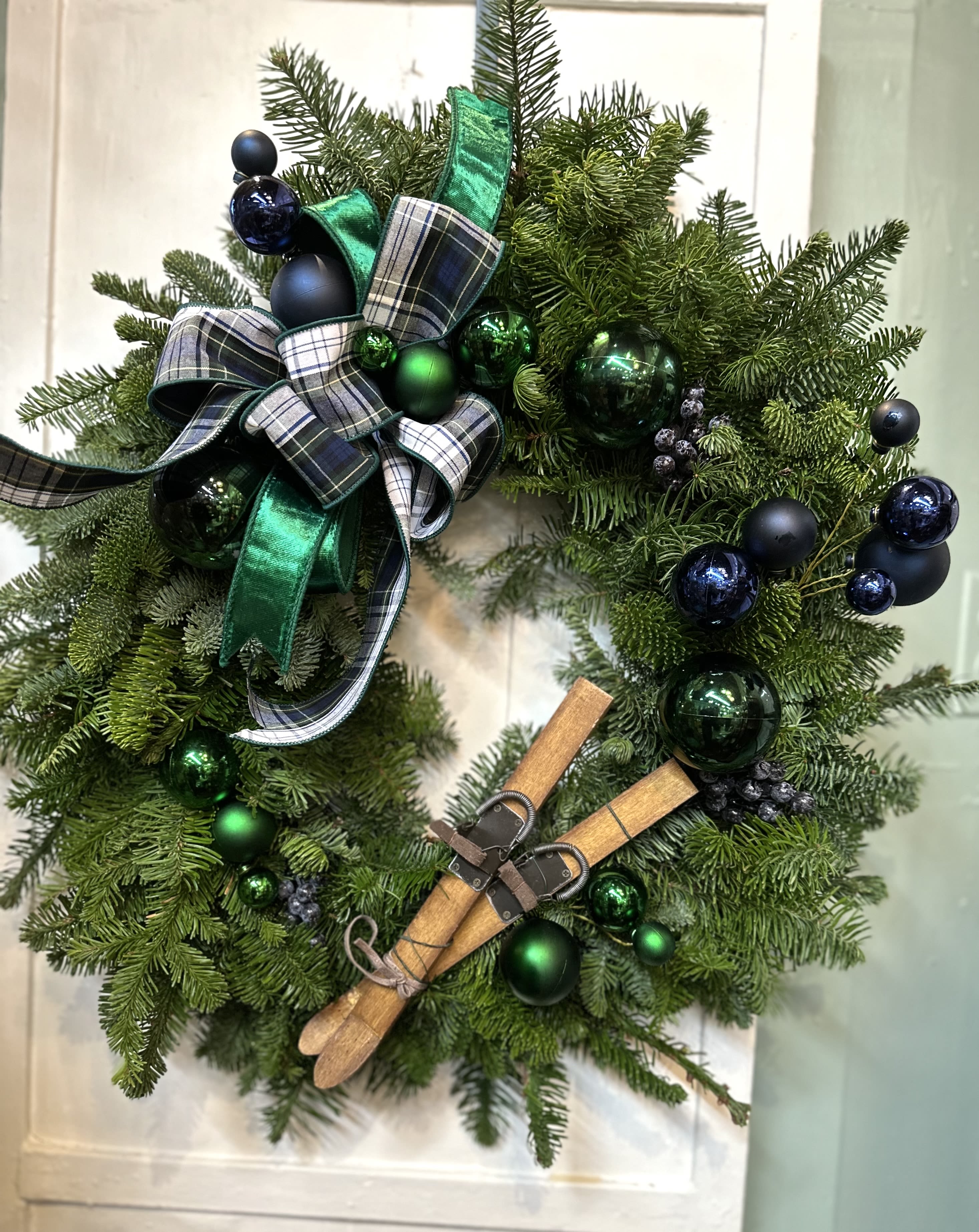 Blue Winter Wreath - Mixed Evergreen wreath featuring ornaments and a holiday bow in festive blues and greens 