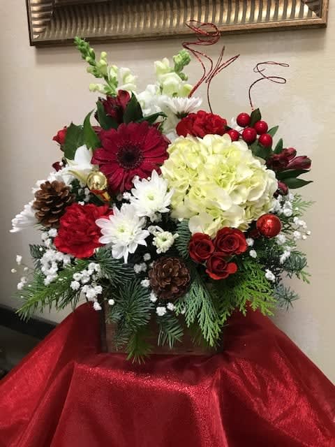 Ponderosa Holiday Rustic Box - Our signature rustic wooden box, filled with all the colors of the Season. With pine cones, balls, and glittery accents, this is a perfect arrangement!