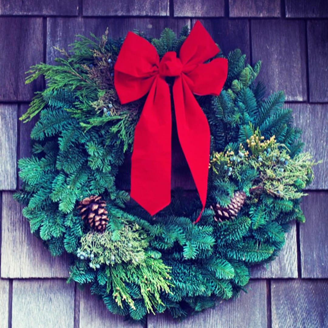 Fresh Evergreen Wreath - Bring the Beauty of Nature to Your Holidays Our Fresh Evergreen Wreaths are the perfect way to celebrate the season with natural charm and timeless elegance. Handcrafted with lush greenery, these wreaths are a thoughtful holiday gift and a beautiful addition to any home. Approximate Sizes > Standard Price= 24inch outside diameter | Deluxe Price= 30inch outside diameter | Premium Price= 34inch outside diameter Southern Tradition: Mobilians love the fresh evergreen scents that fill their homes, adding to the crisp Southern Alabama winter mornings. Versatile Décor: Perfect for entryways, living rooms, or any space needing a touch of holiday cheer and natural beauty. Timeless Elegance: A traditional symbol of everlasting life, our wreaths bring a sense of rejuvenation and the liveliness of nature into your home. Celebrate the holidays with the fresh, invigorating scent of evergreen and the natural beauty of our wreaths, perfect for gifting or enhancing your seasonal décor.