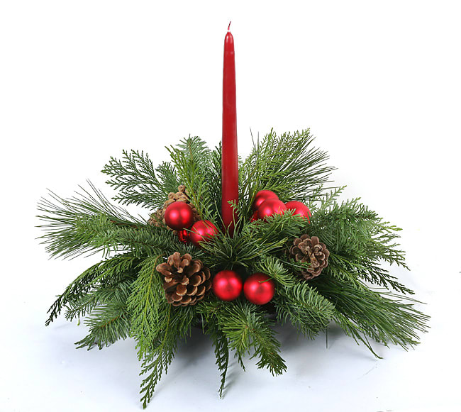 Holiday Centerpiece - A holiday arrangement for any event. As a beautiful Christmas centerpiece or mantle decoration, this unique arrangement mixes shiny red balls with festive greens around a red candle. Designed in a vase and delivered by us, a real Portland florist to anywhere in the greater Portland Oregon area. Place your order online, or call us directly 503 223 1646
