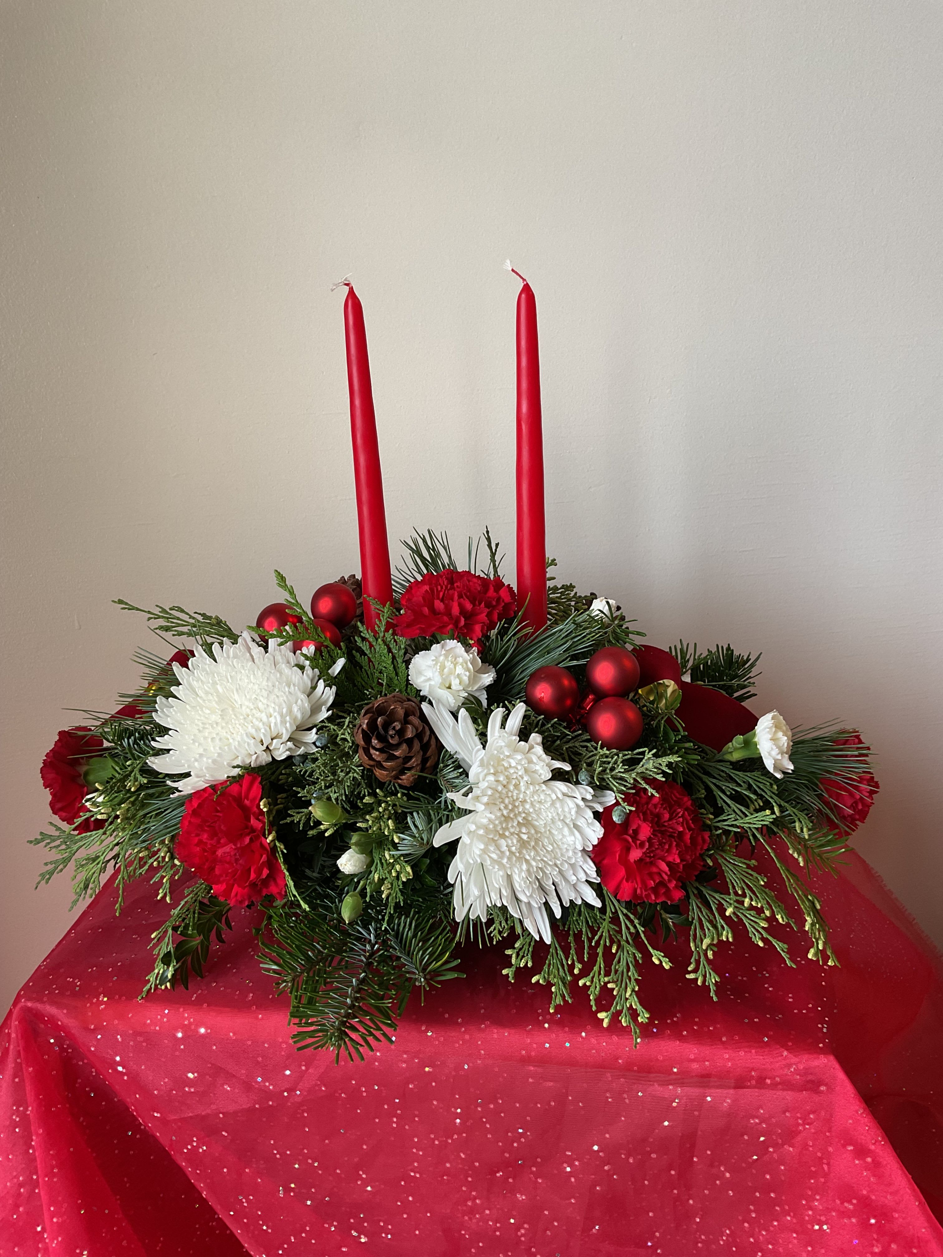 Long &amp; Low X-mas Centerpiece - A gorgeous long and low masterpiece for the center of your Christmas Feast. Each arrangement is filled with Christmas greenery and decorated to match the beautiful holiday among us.