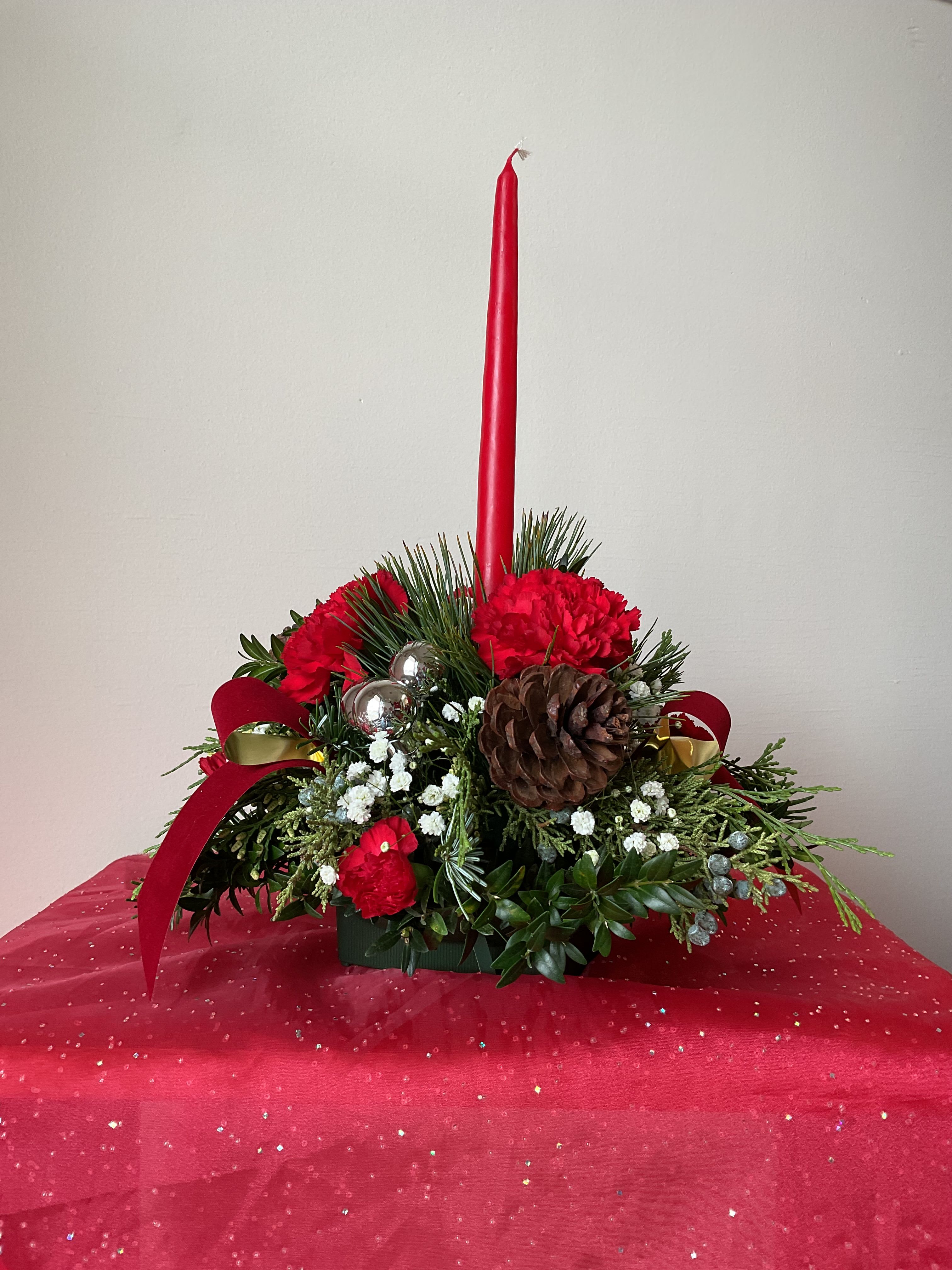 Round X-mas Centerpiece - Perfect for the center of your Christmas Feast. Each arrangement is filled with Christmas greenery and decorated to match the beautiful holiday among us.