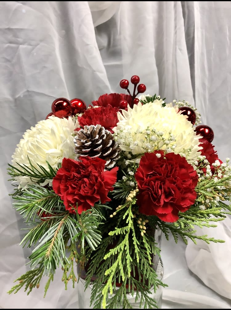 Mixed red and white flowers in low compact vase - Low compact vase reds and whites