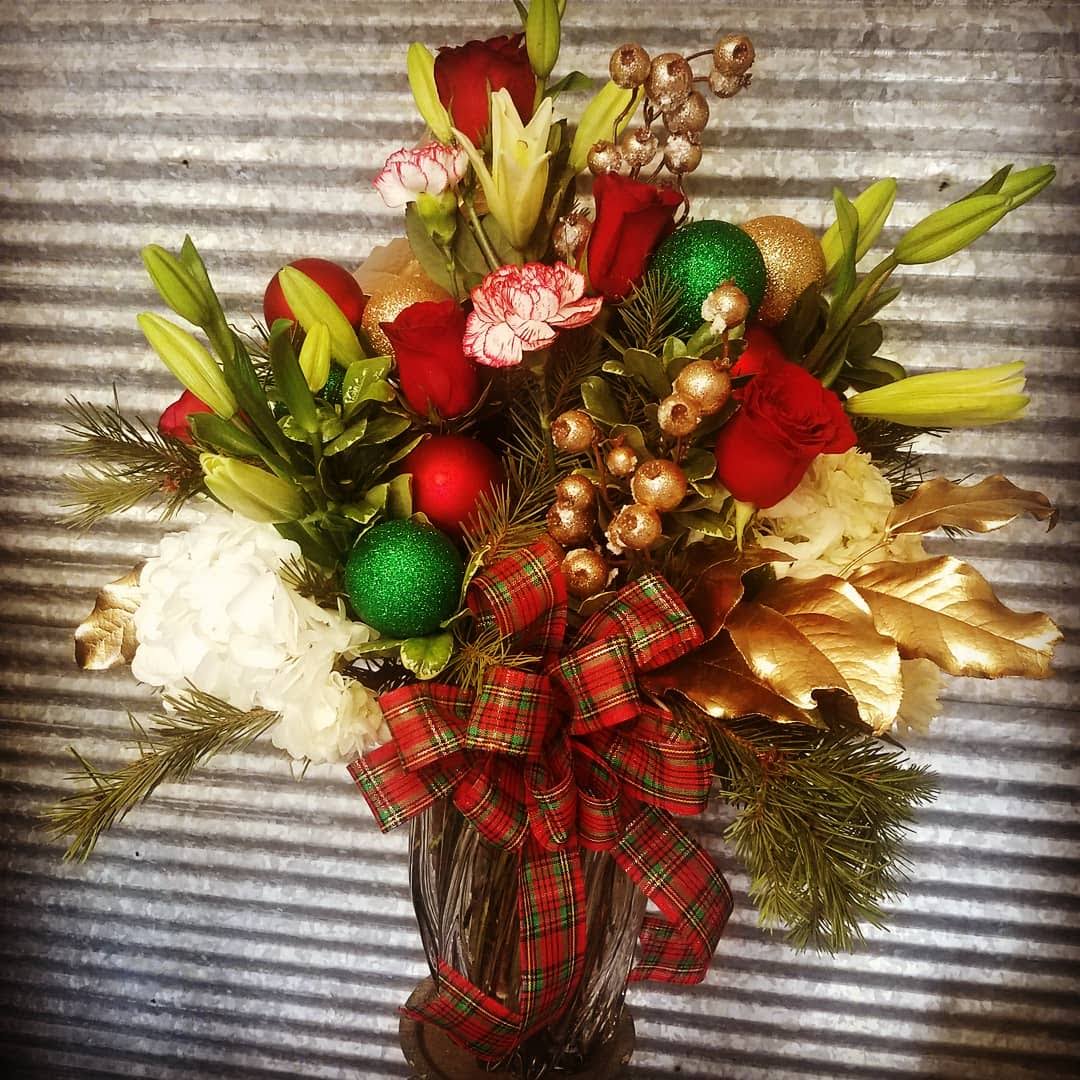 Festive Christmas greetings - Show your Christmas cheer with this beautiful vase of Seasonal festive flowers 