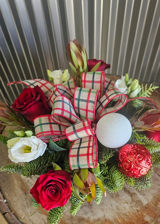 Classic Centerpiece  - A classic Centerpiece of Christmas Greens, Flowers, Ornaments and Ribbon. Great for any Holiday table