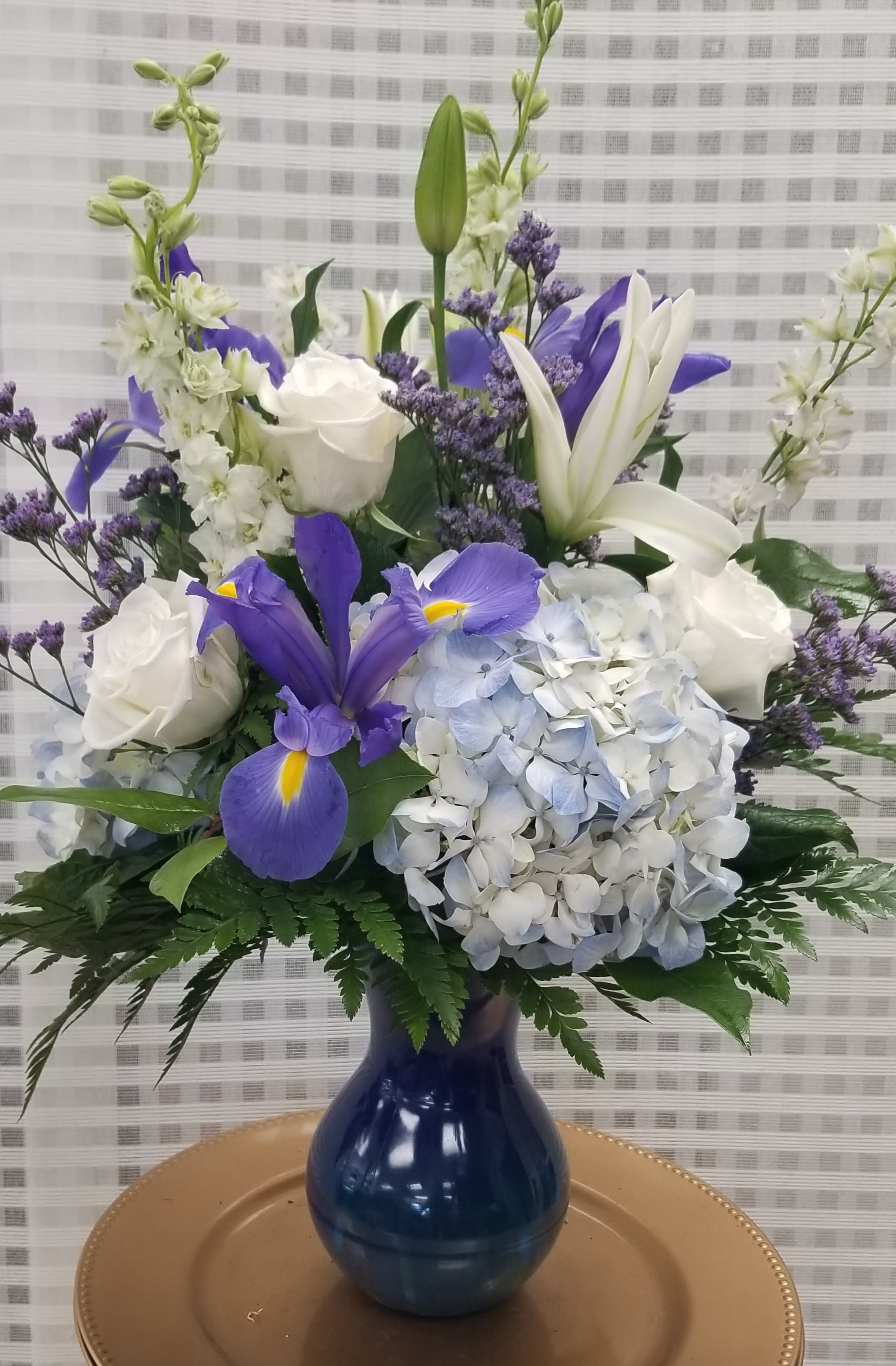 Breathtaking Blue. - An arrangement of fresh blue hydrangea, iris, white roses, white lilies. 