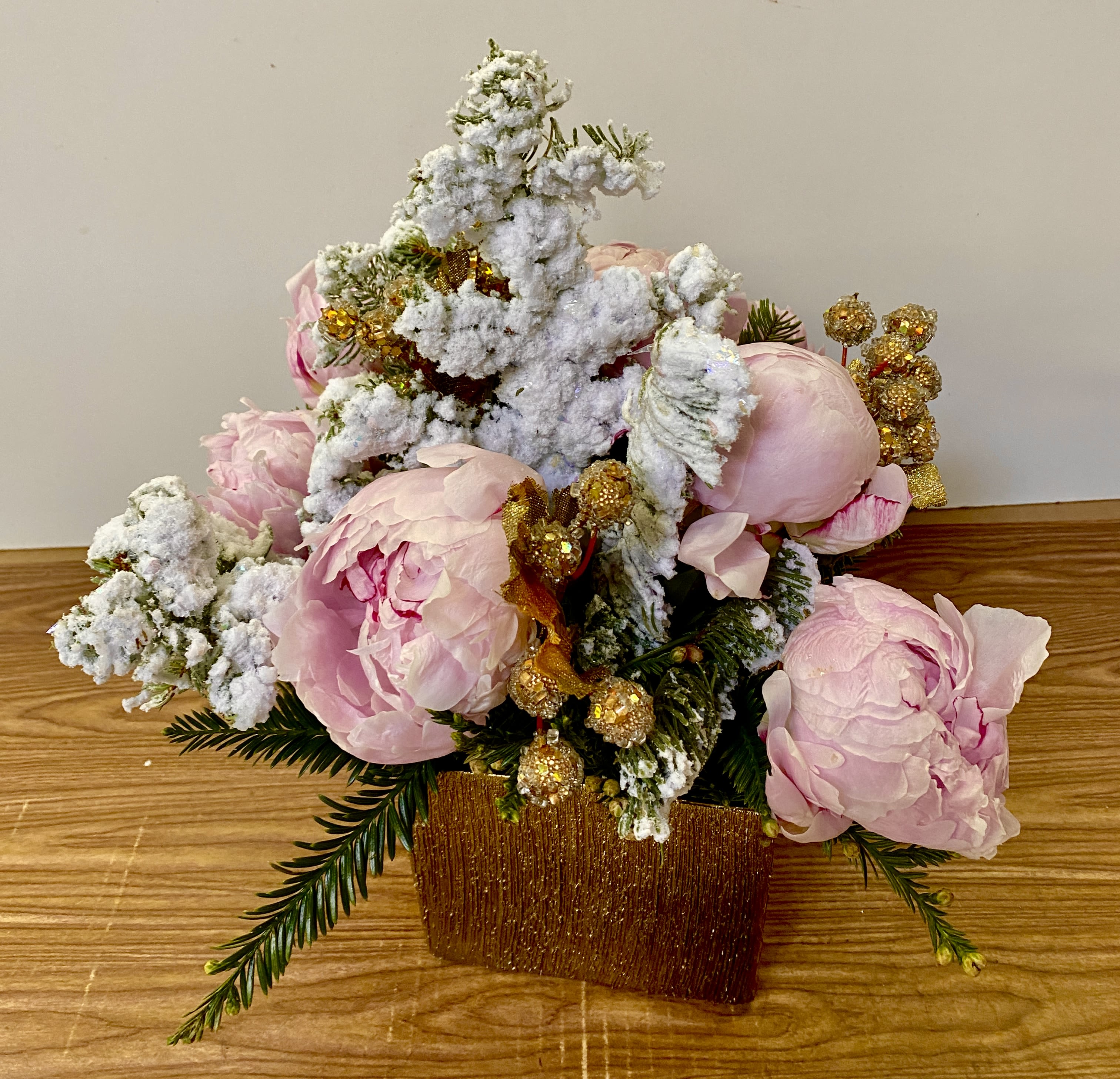 OUR LITTLE SECRET  - In a clear glass vase combination of being peonies and Christmas balls